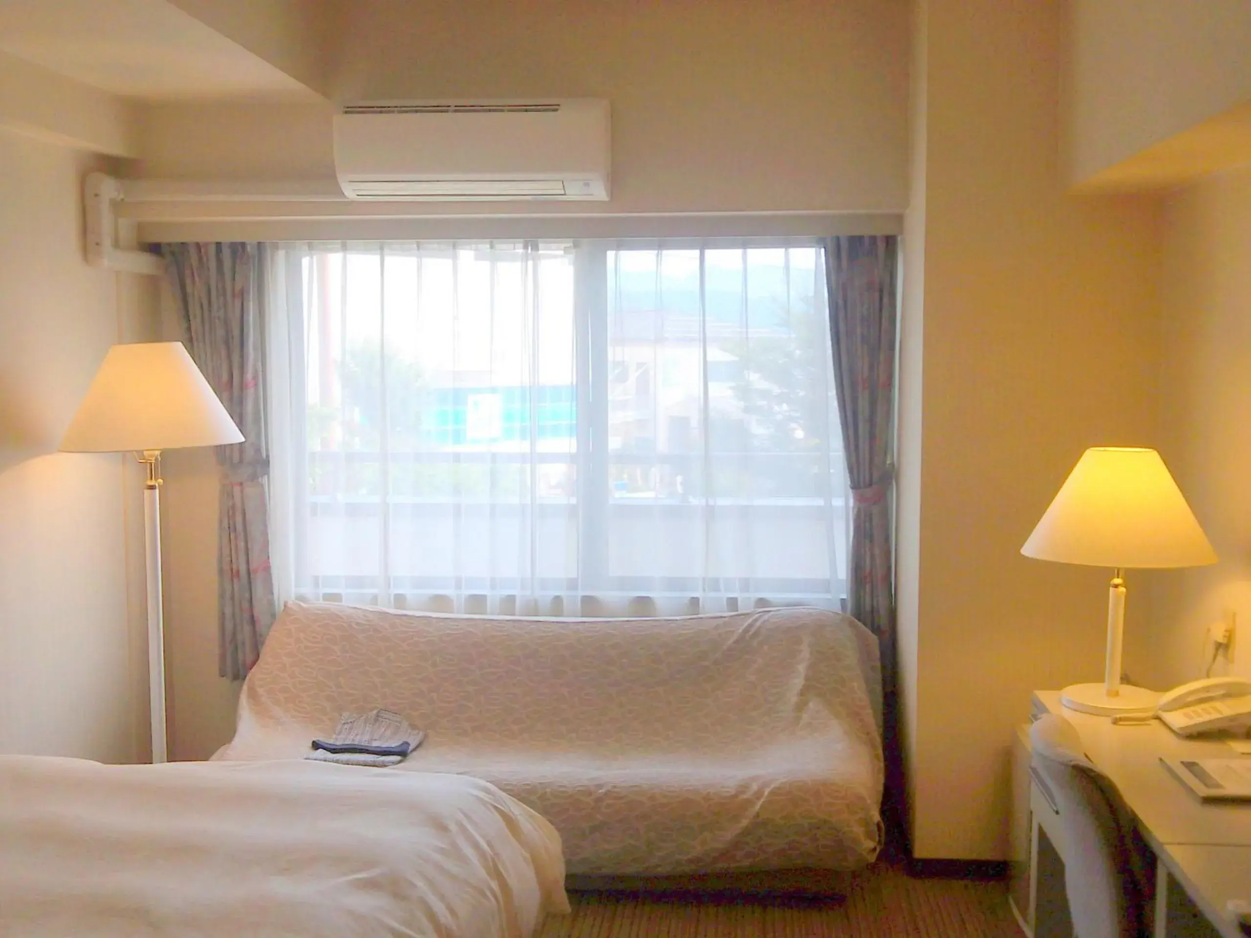 Photo of the whole room, Bed in Okaya Central Hotel