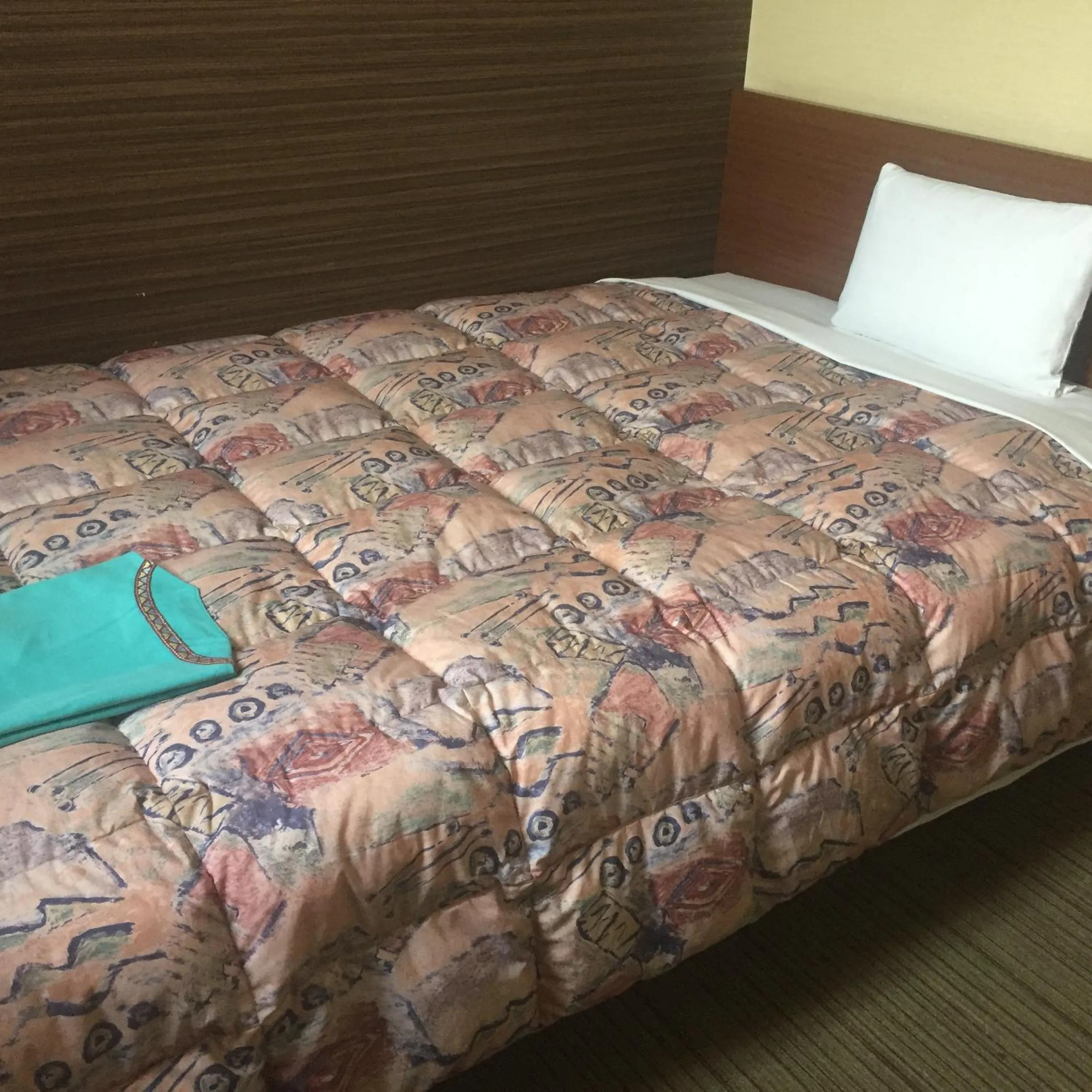 Bed in Hotel Niihama Hills