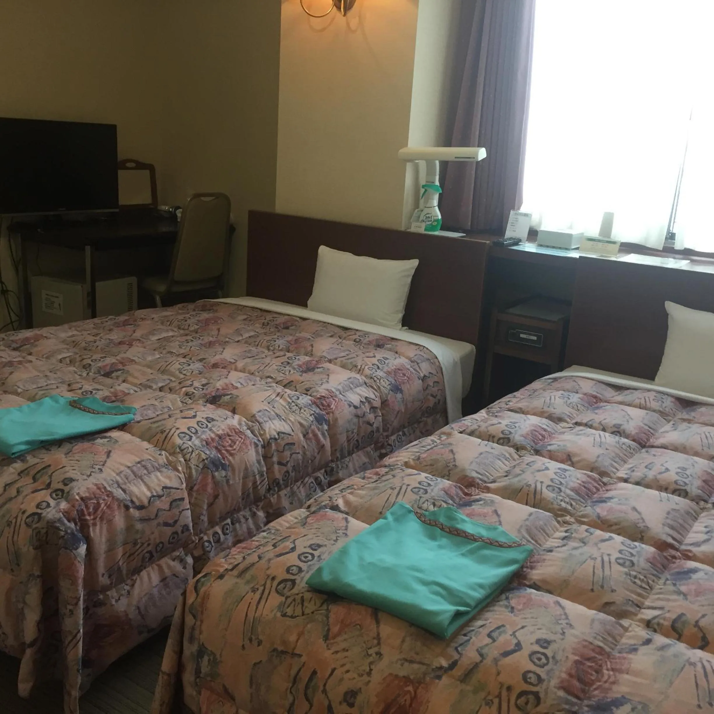 Bed in Hotel Niihama Hills