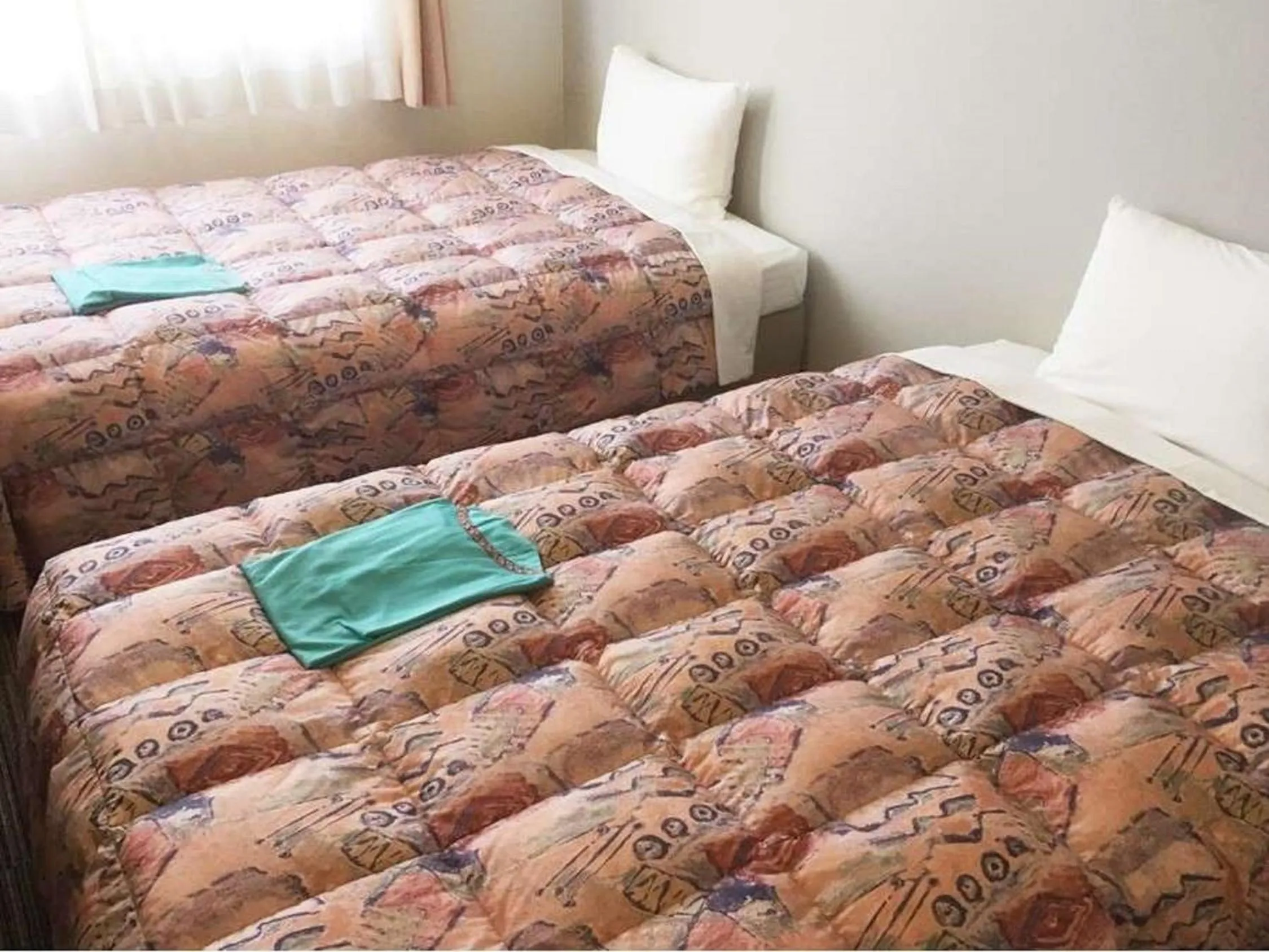 Bed in Hotel Niihama Hills Prince House