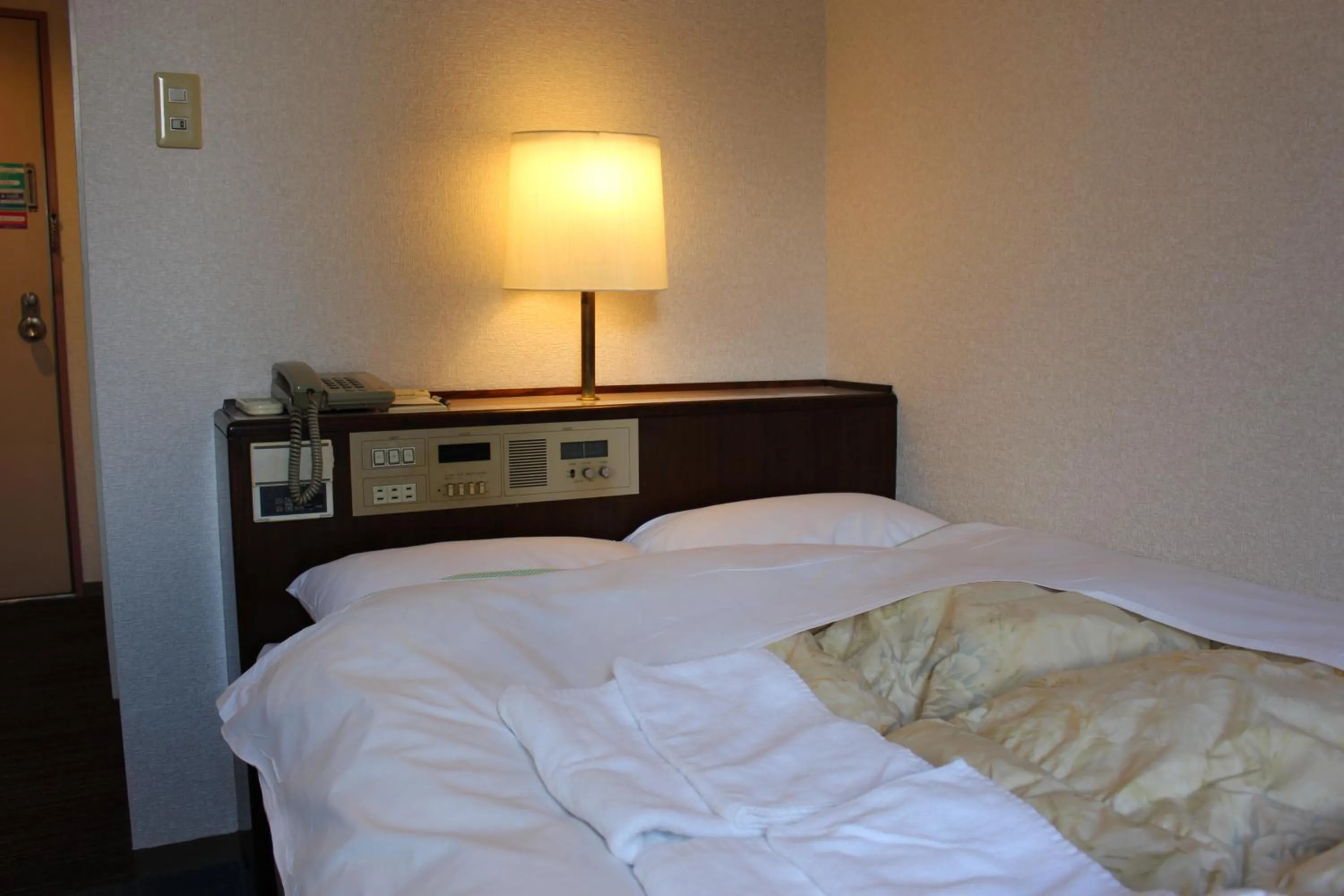 Bed in Hotel Higashihiroshima Hills Saijo