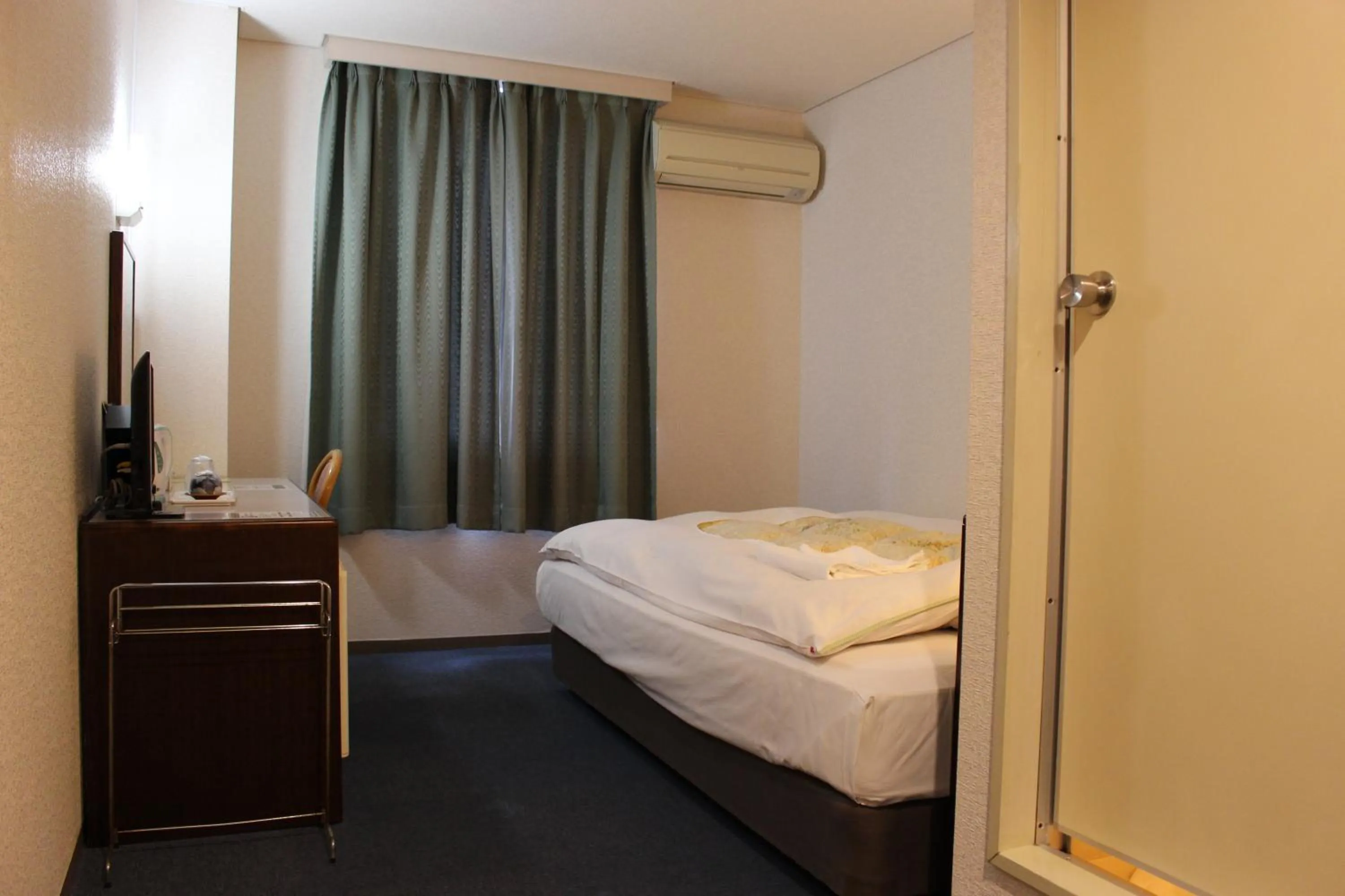 Bed in Hotel Higashihiroshima Hills Saijo