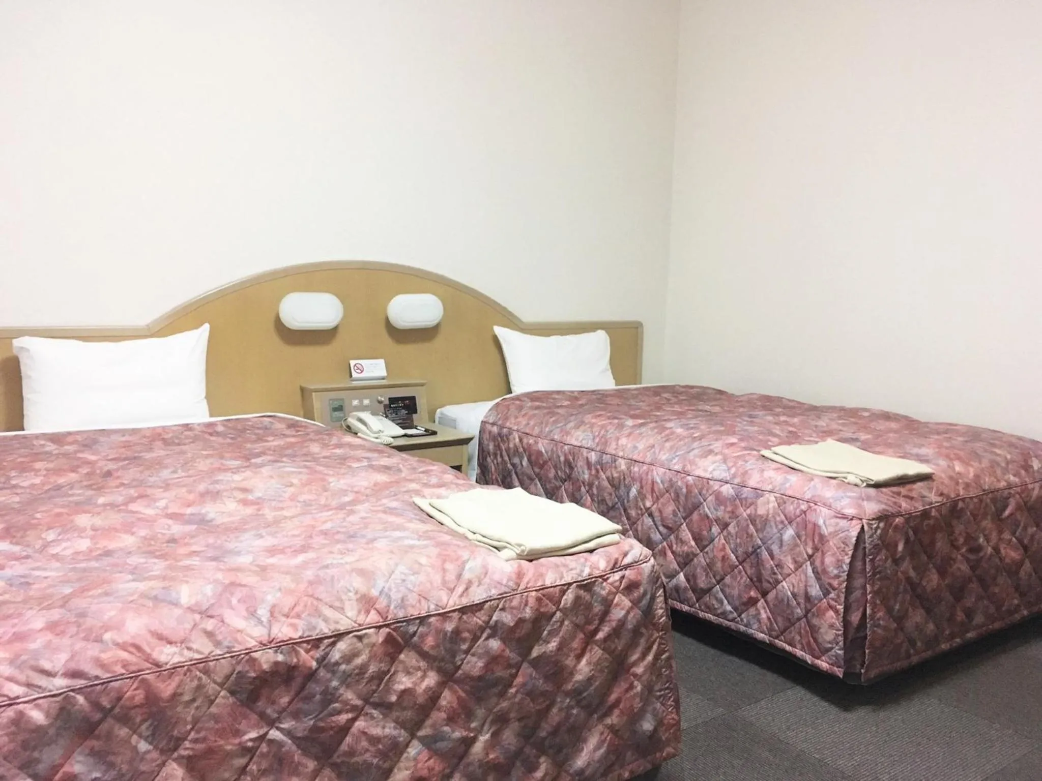 Bed in Oustat Kokusai Hotel Tajimi