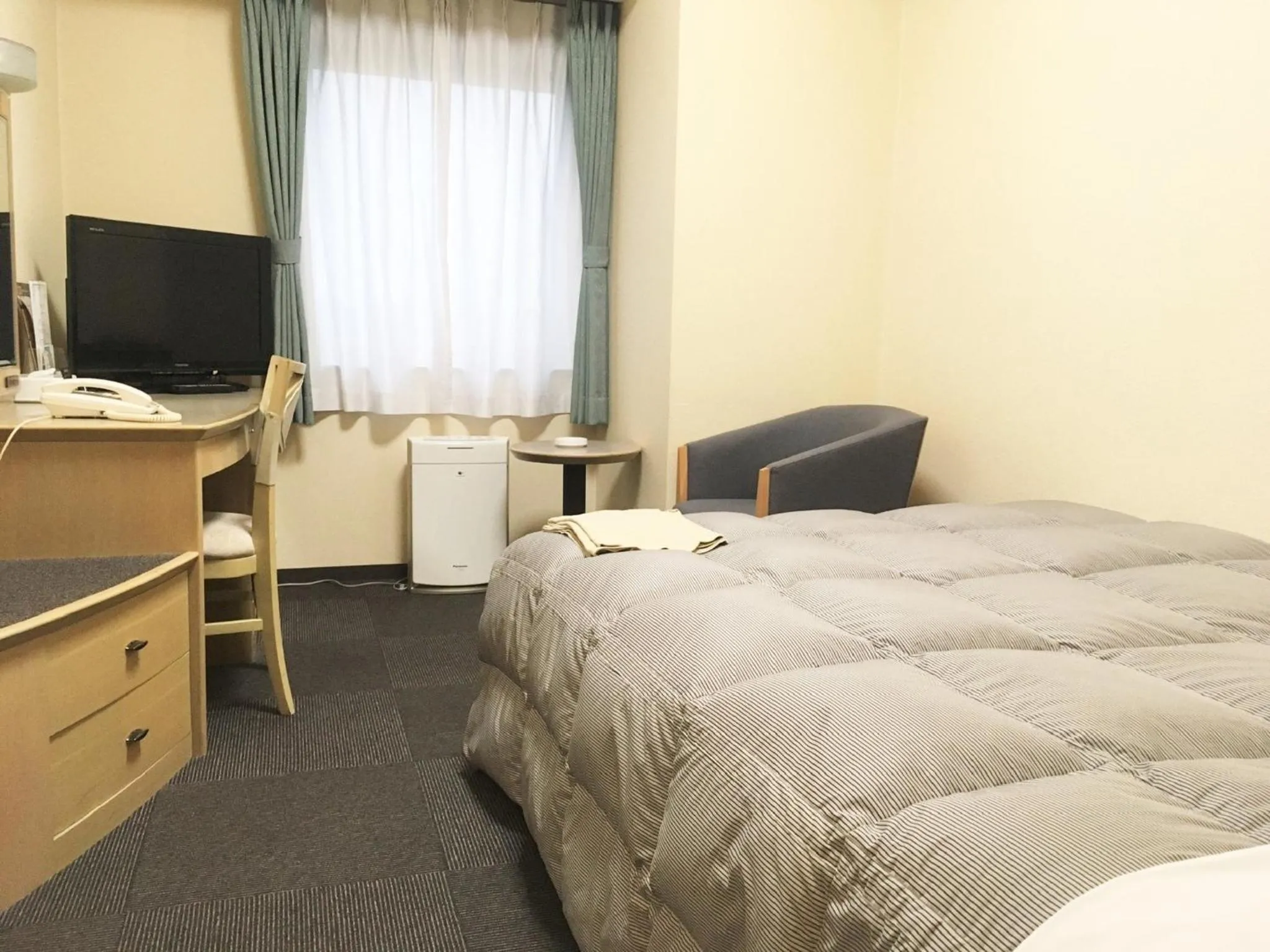 Bed in Oustat Kokusai Hotel Tajimi