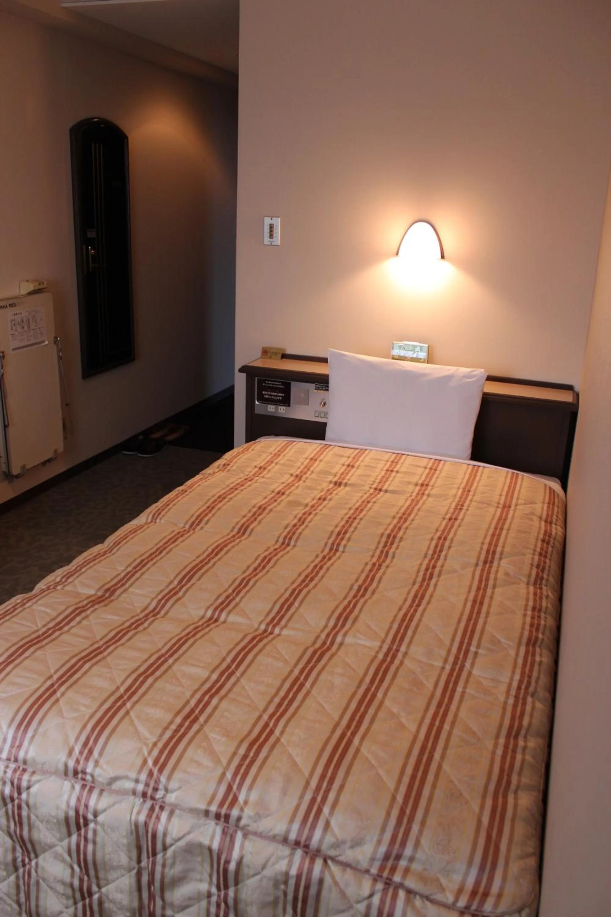 Photo of the whole room, Bed in Hotel Crown Hills Takaoka