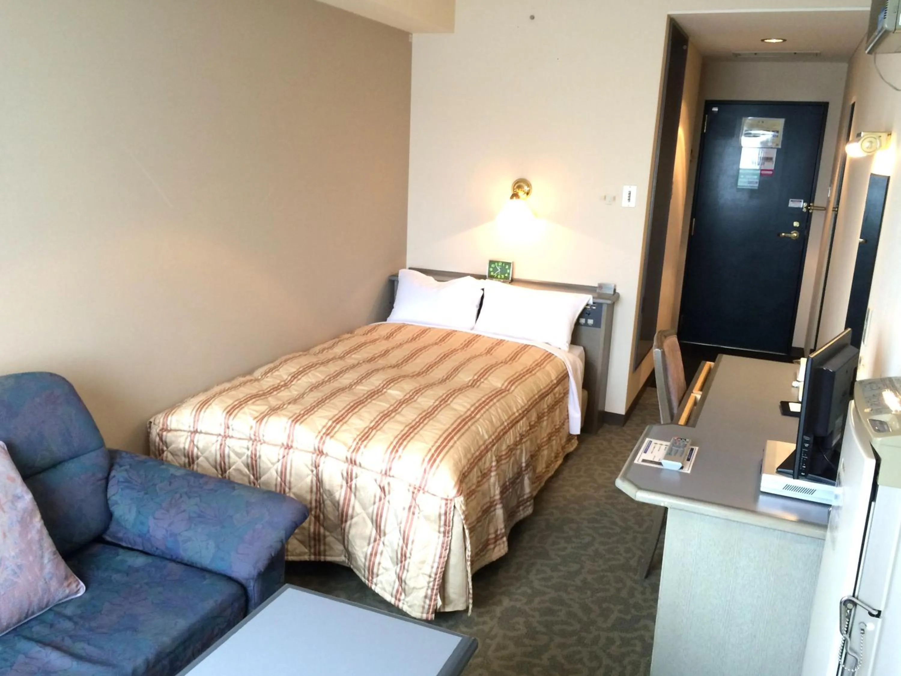 Photo of the whole room, Bed in Hotel Crown Hills Takaoka