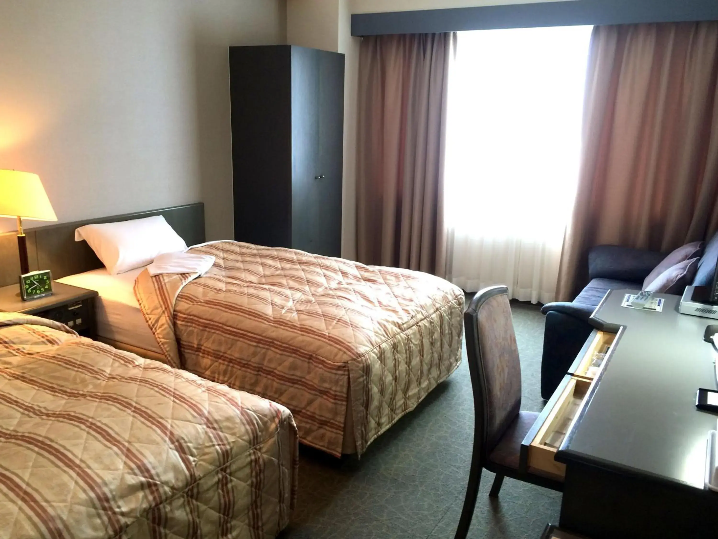 Photo of the whole room, Bed in Hotel Crown Hills Takaoka