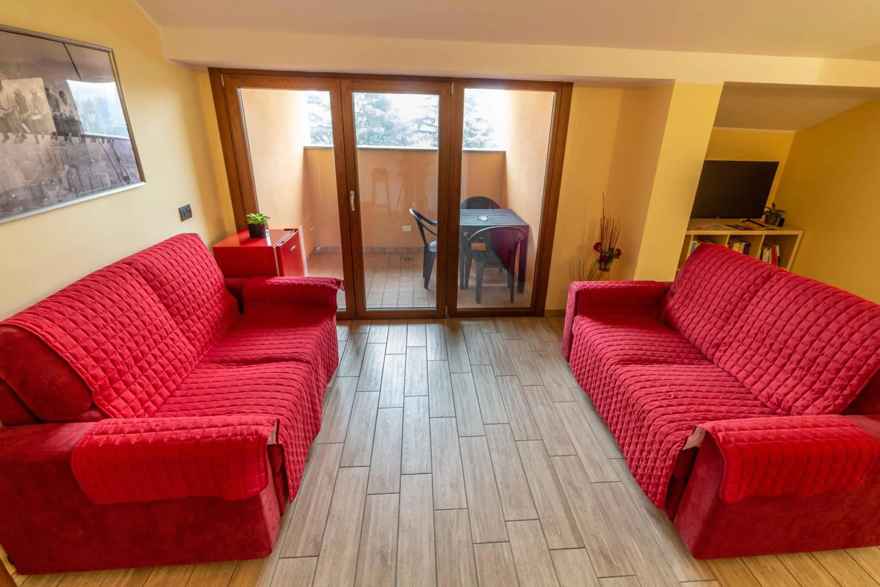 Communal lounge/ TV room in B&B Alla Roggetta