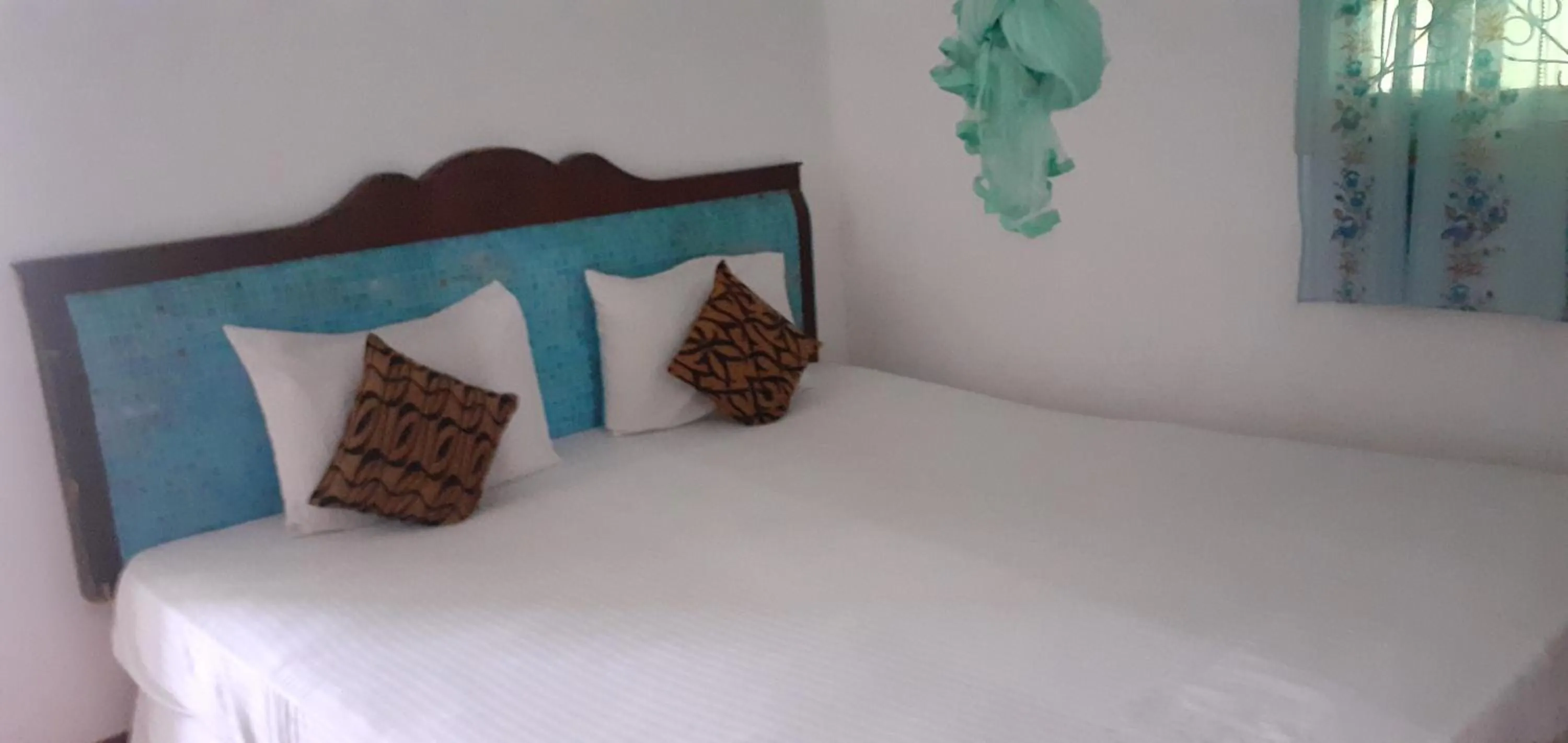 Bed in Nilaveli Beach Rooms