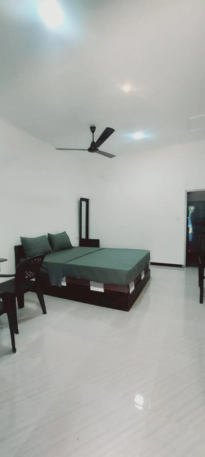 Bed in Nilaveli Beach Rooms