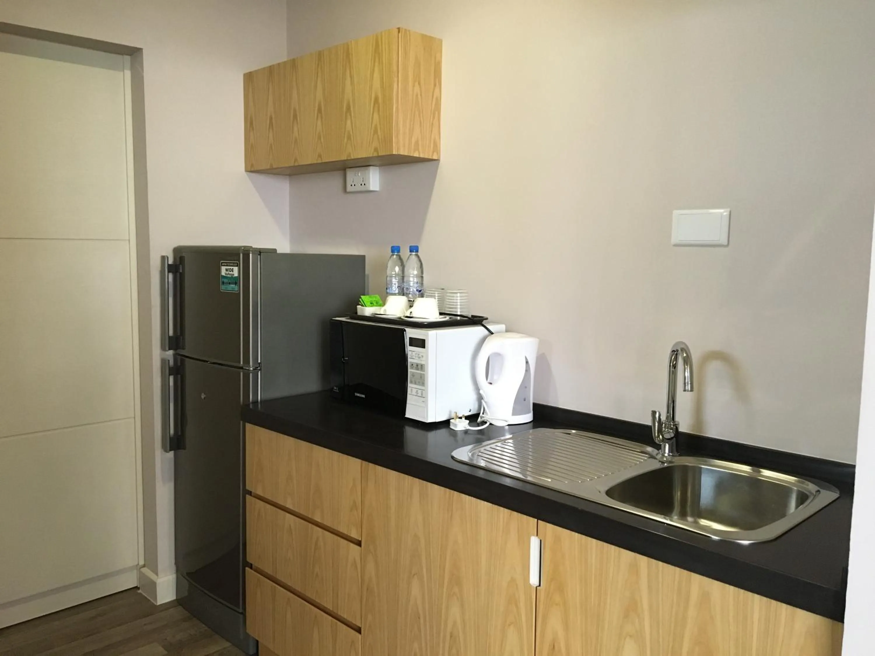 Kitchen or kitchenette in D'Anggerek Serviced Apartment