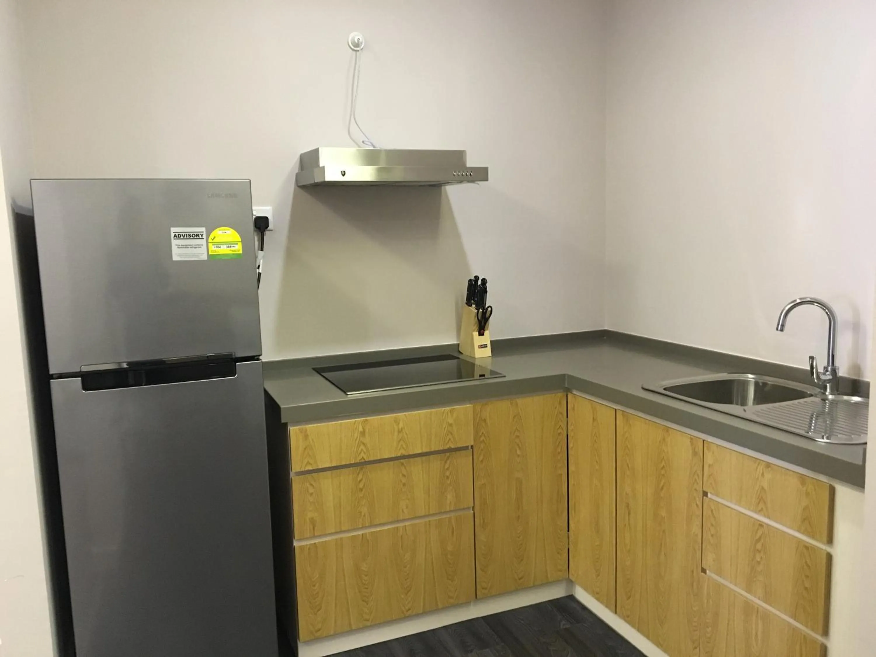 Kitchen or kitchenette in D'Anggerek Serviced Apartment