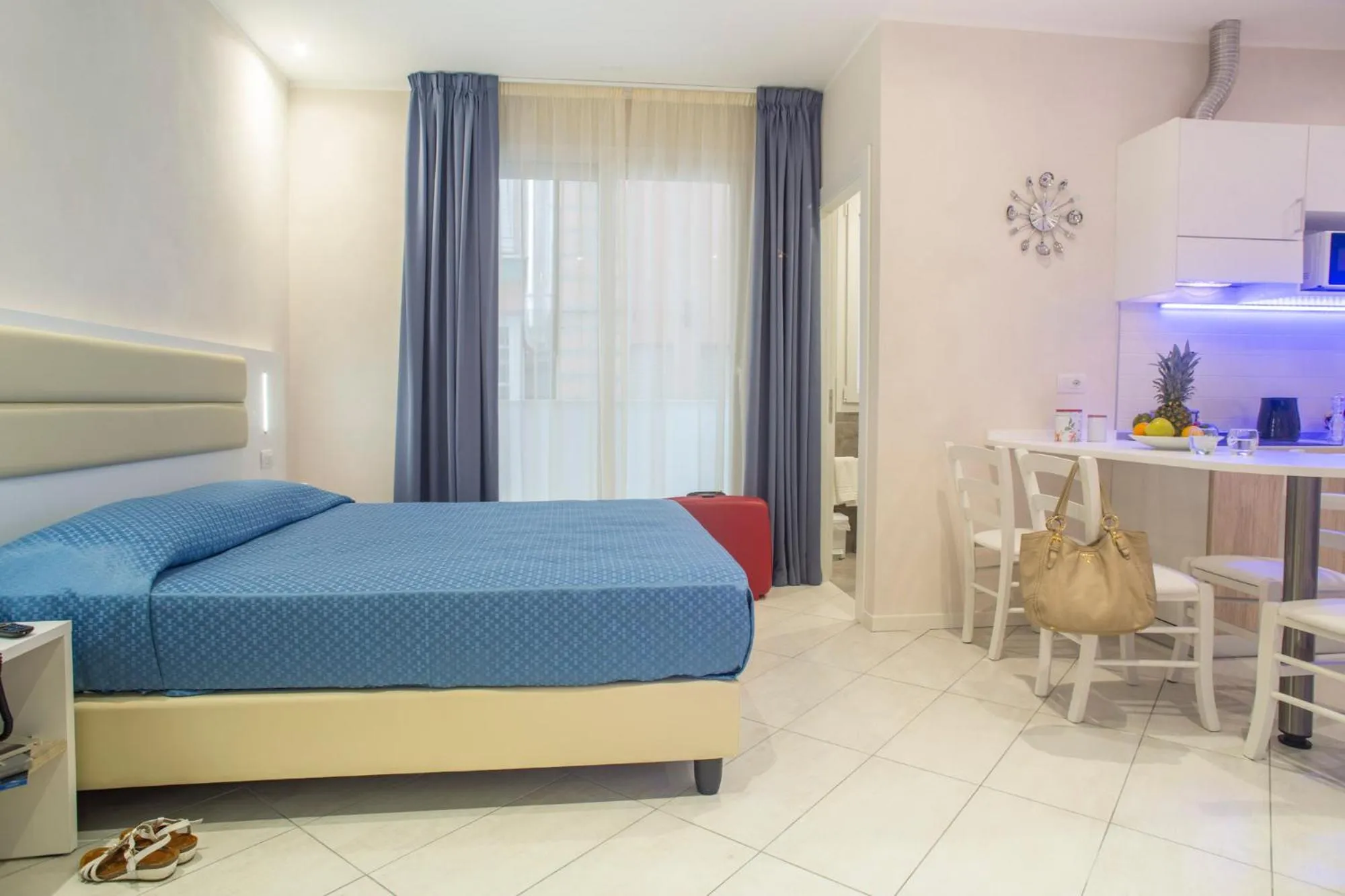 Bed in White Suite & Apartments