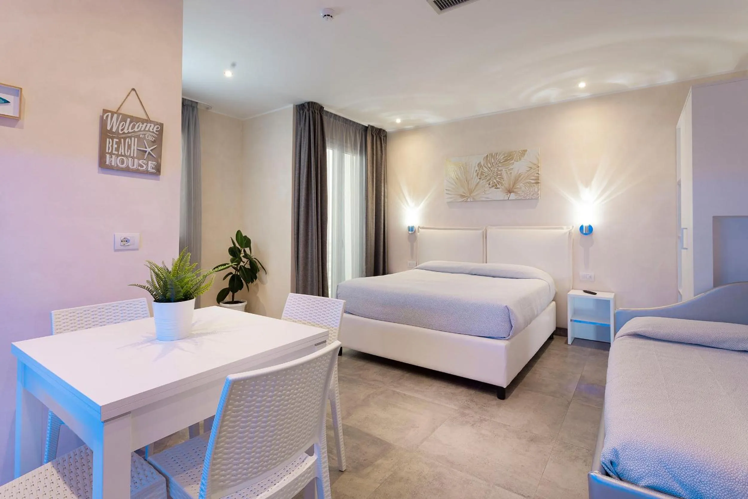 Bed in White Suite & Apartments