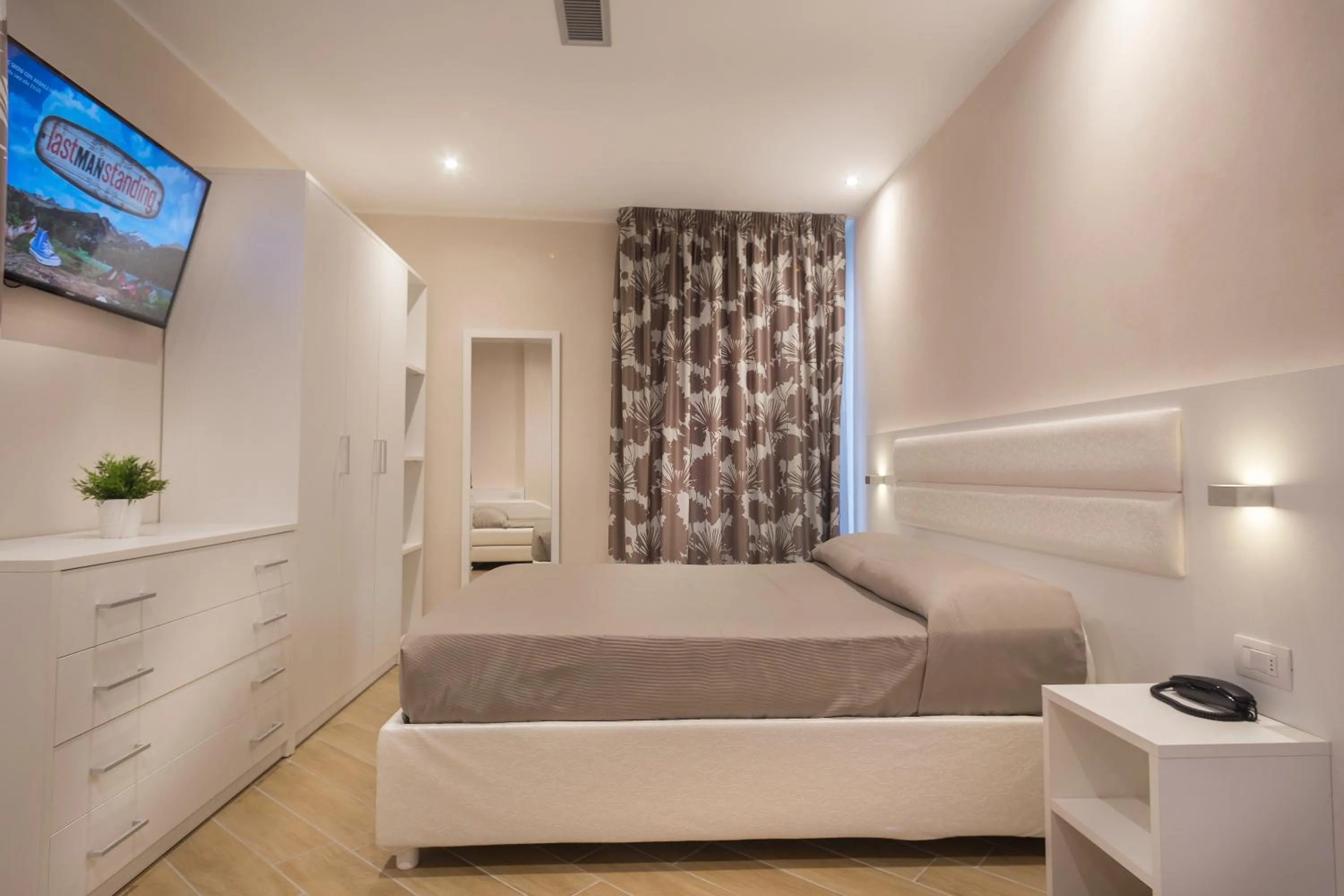 Bed in White Suite & Apartments