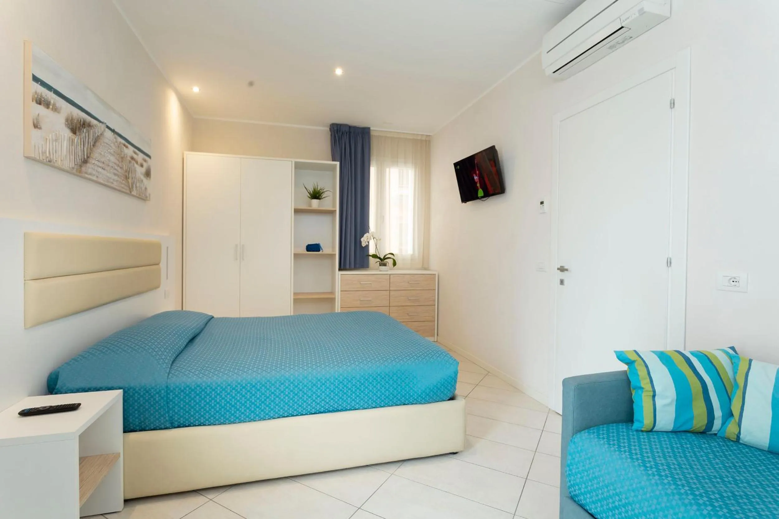 Bed in White Suite & Apartments