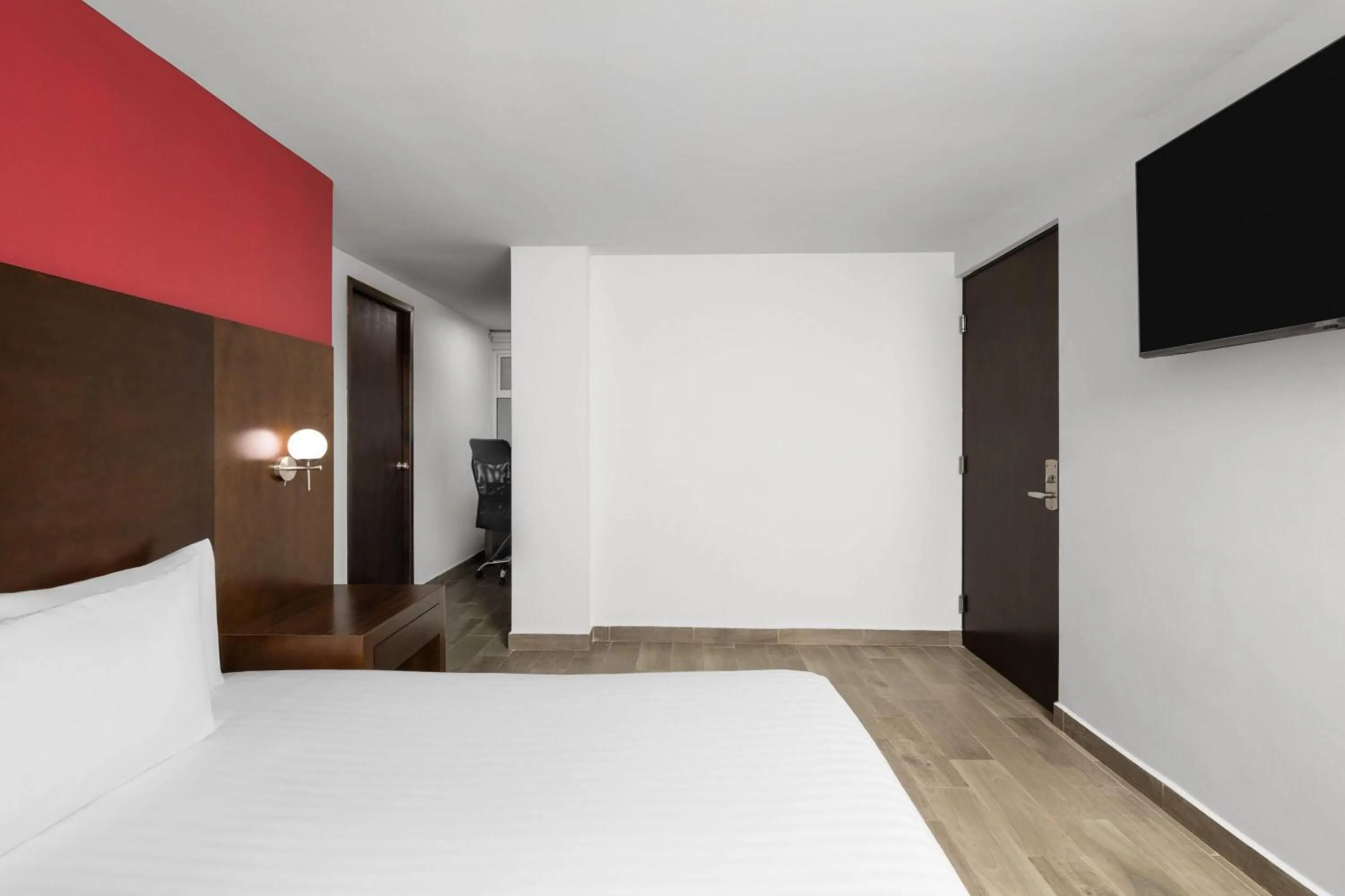 Photo of the whole room, Bed in Ramada by Wyndham Tampico Centro