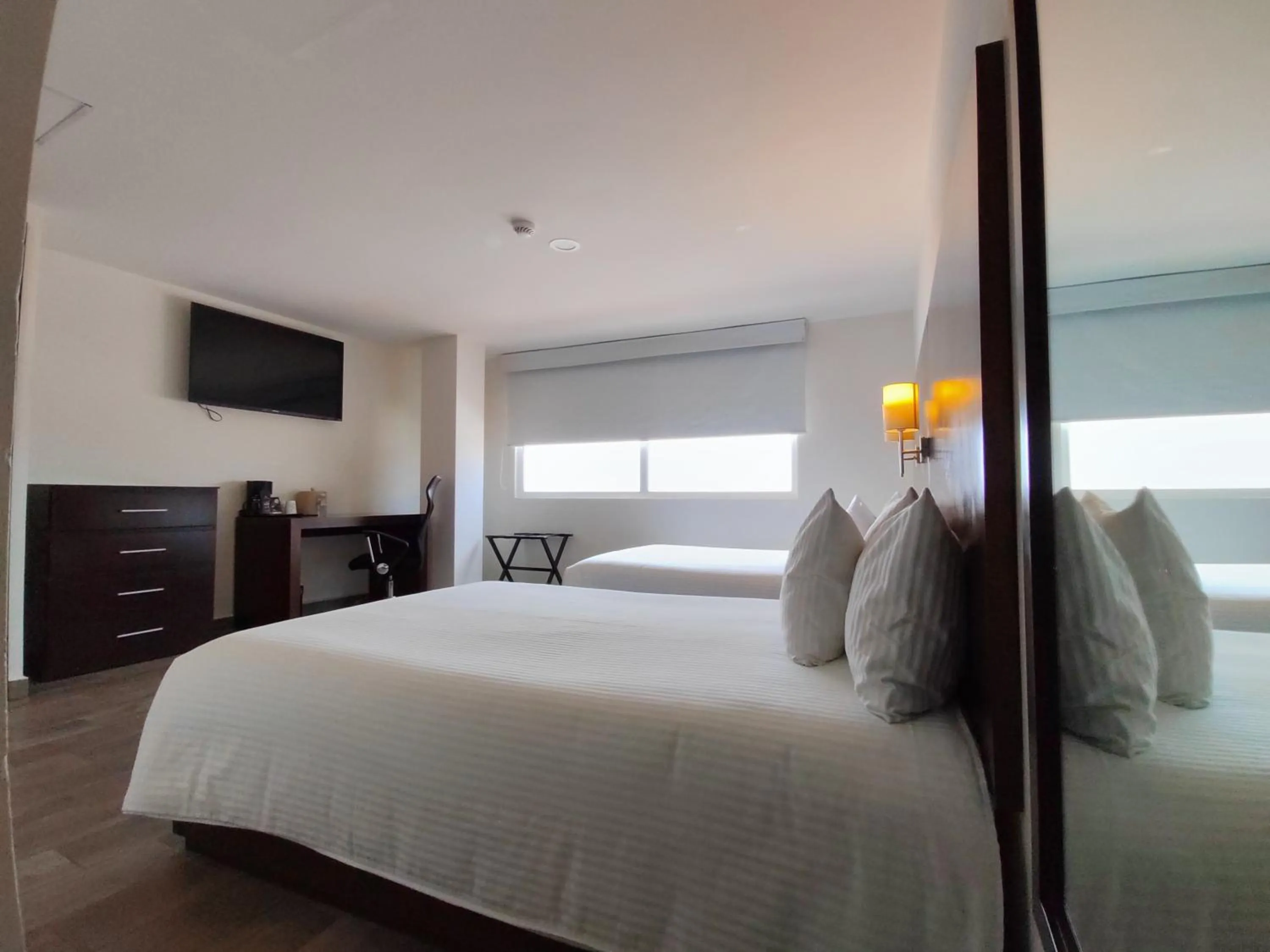 Photo of the whole room, Bed in Ramada by Wyndham Tampico Centro