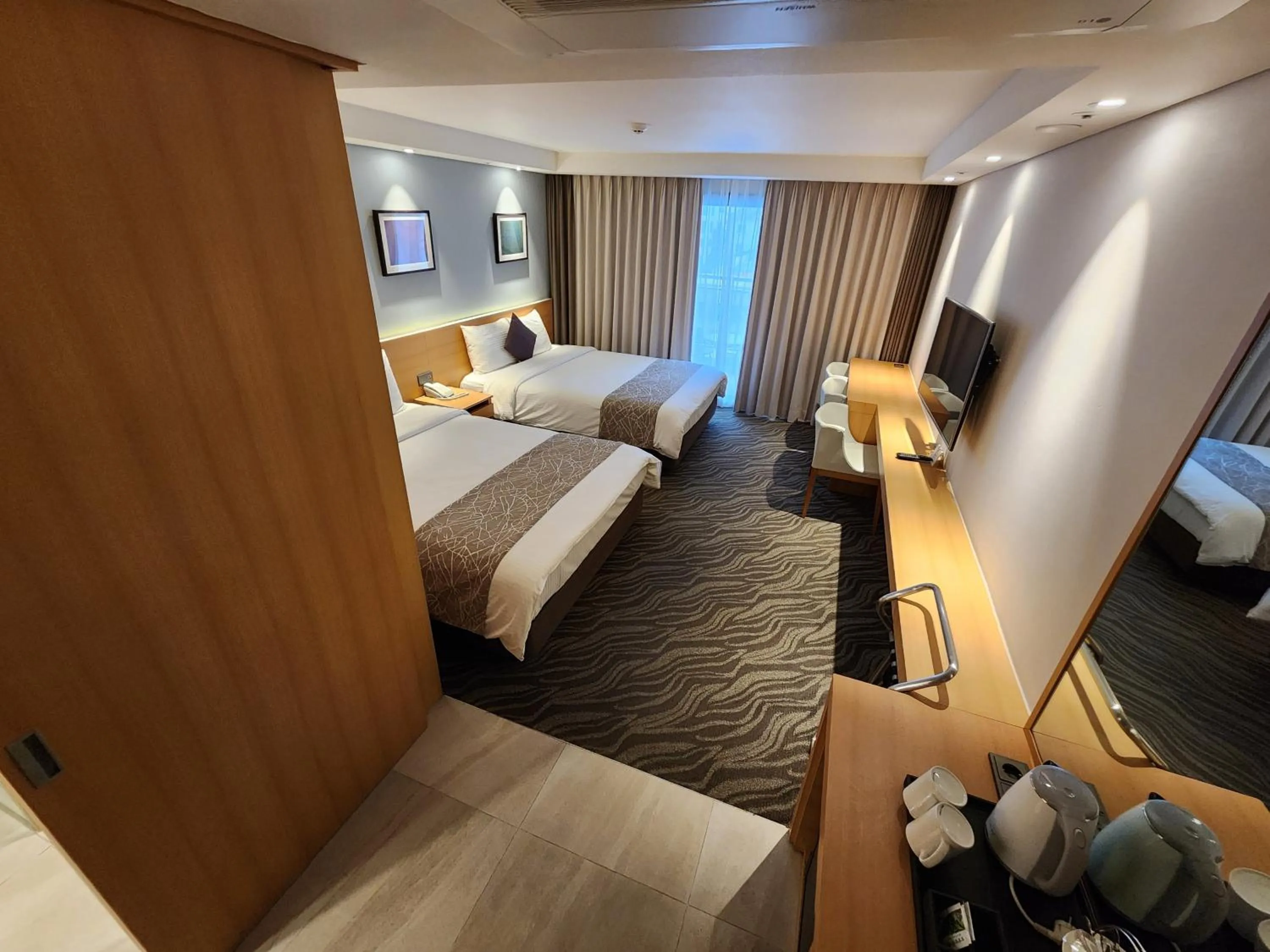 Bed in Seogwipo JS Hotel