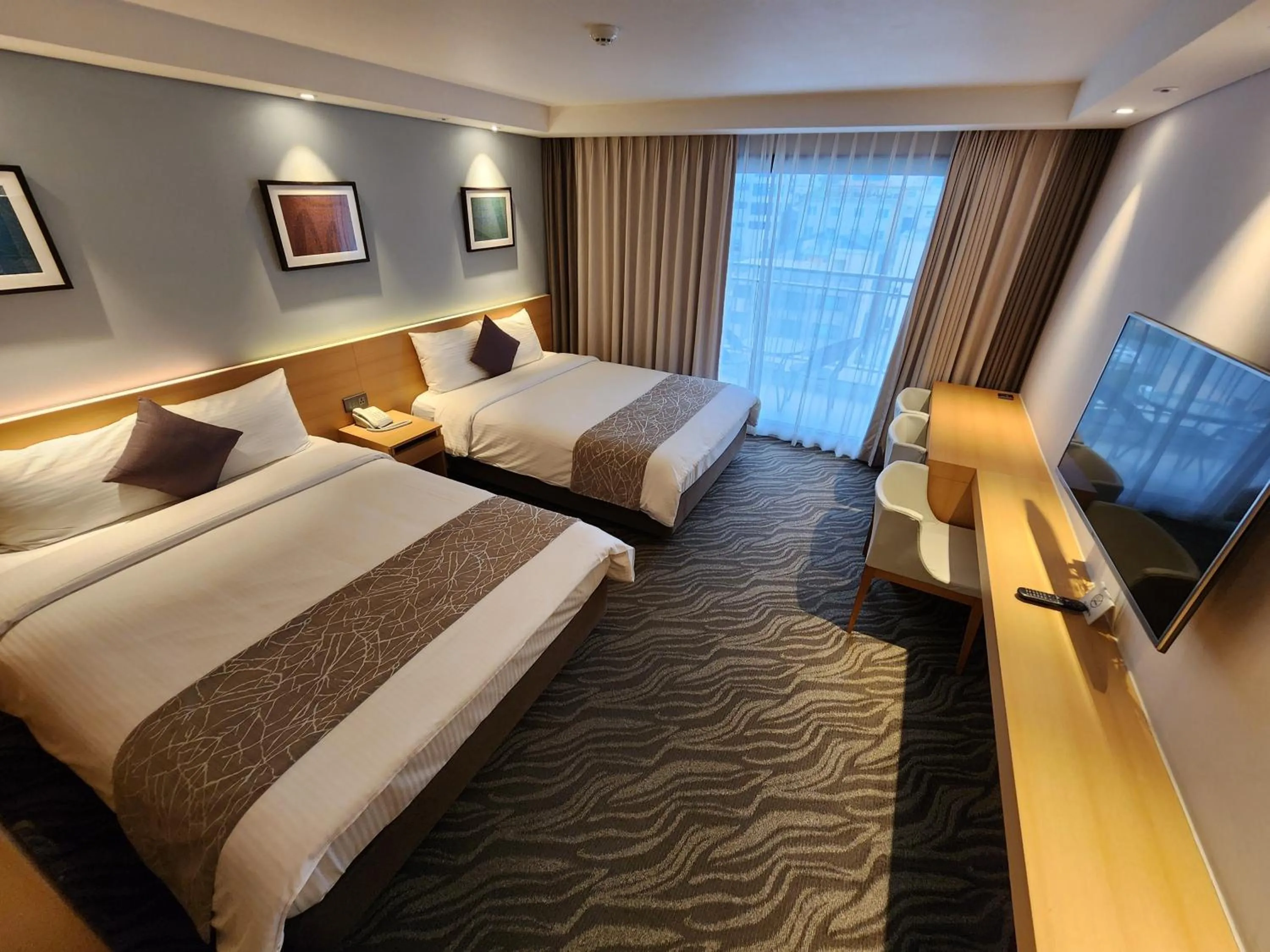 Bed in Seogwipo JS Hotel