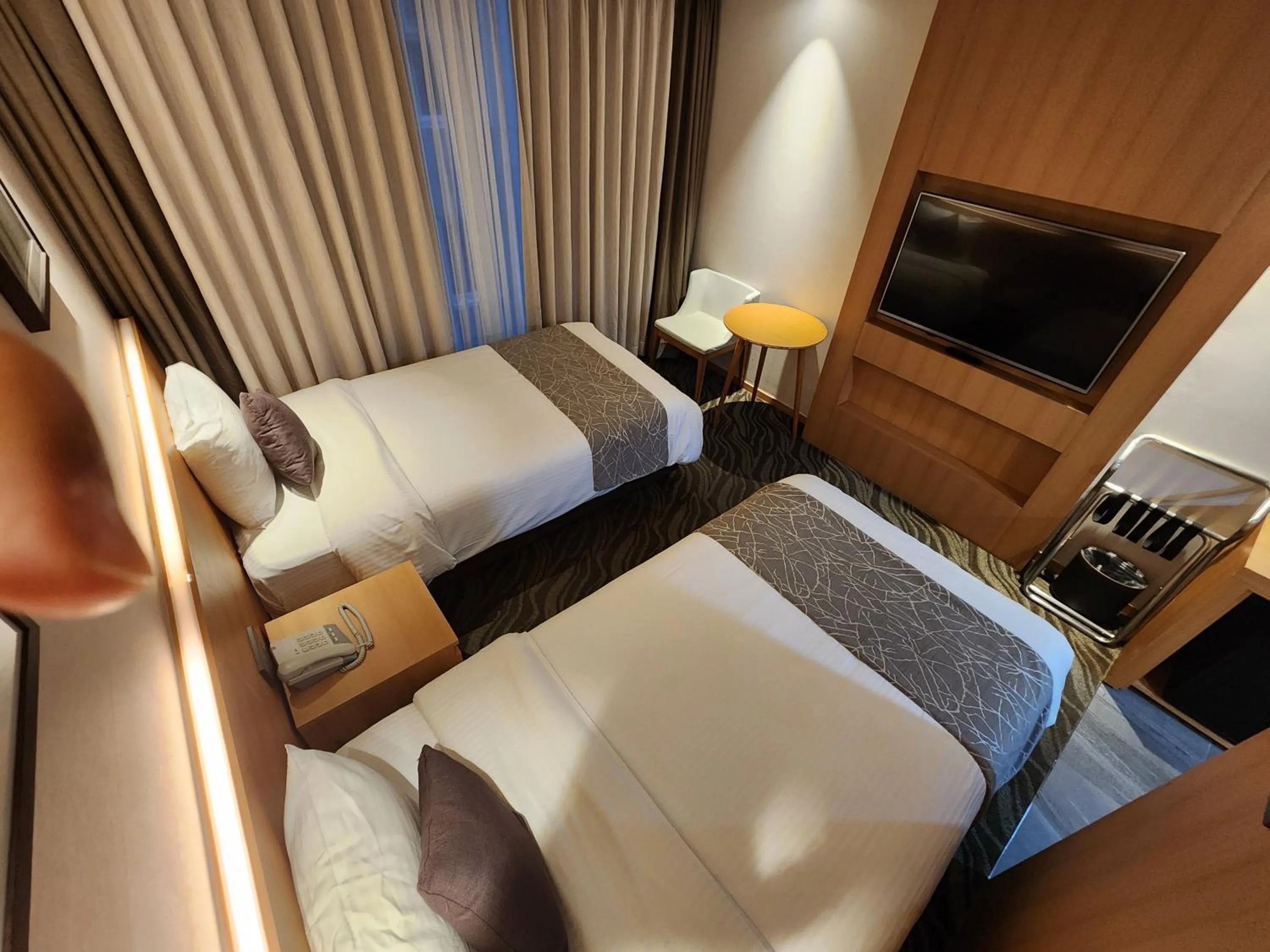 Bed in Seogwipo JS Hotel