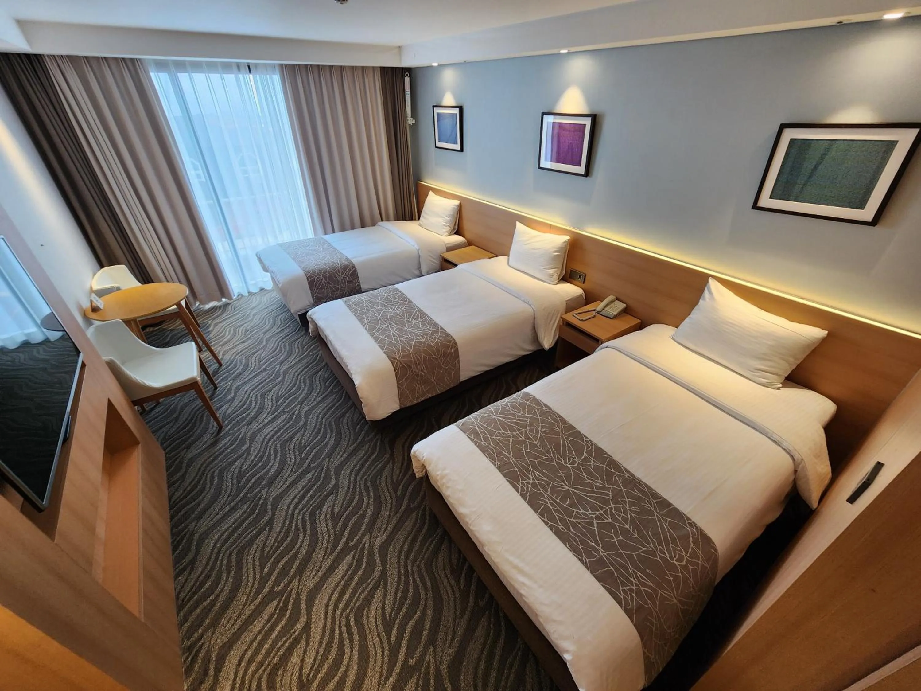 Bed in Seogwipo JS Hotel