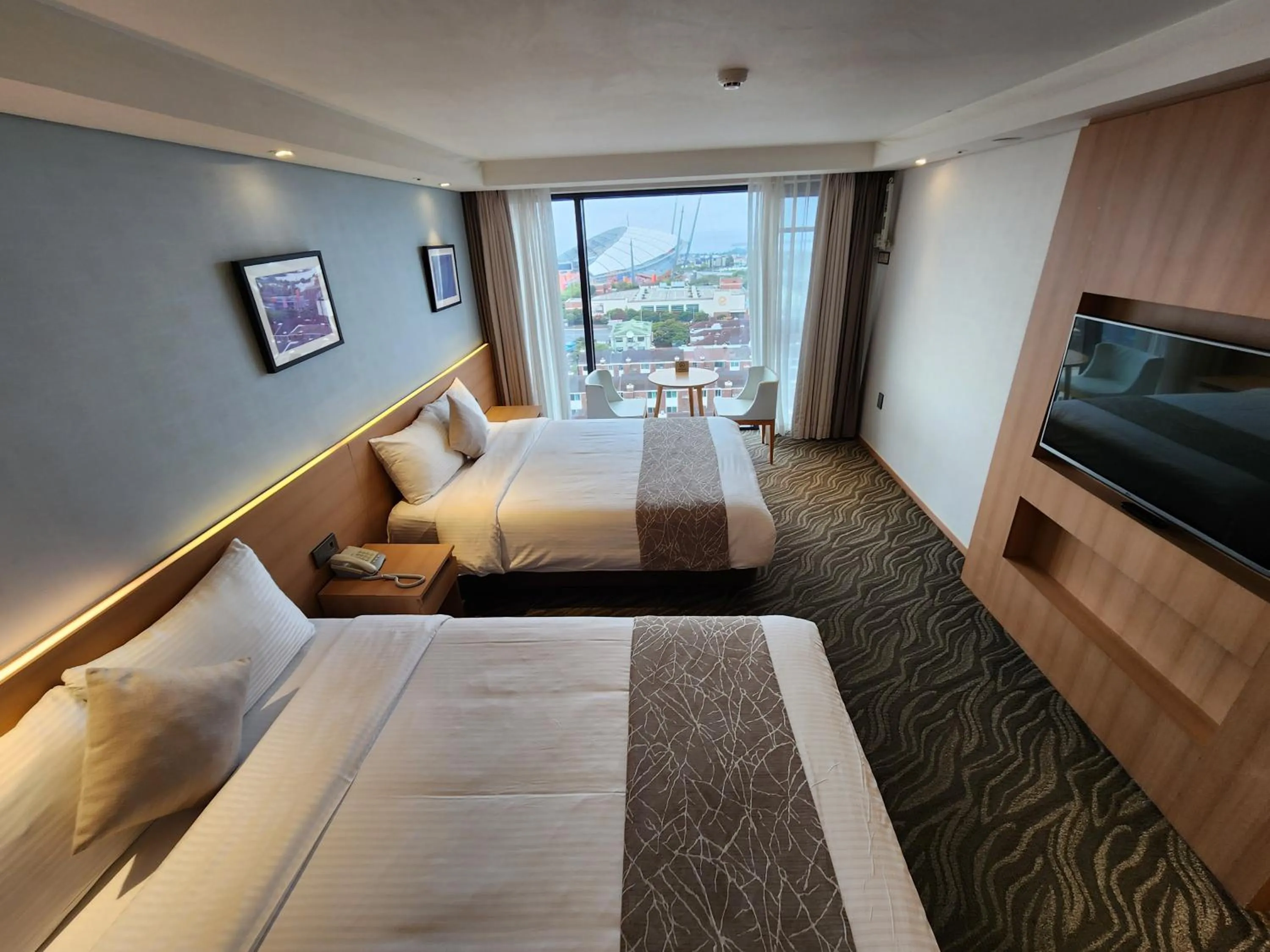 Bed in Seogwipo JS Hotel