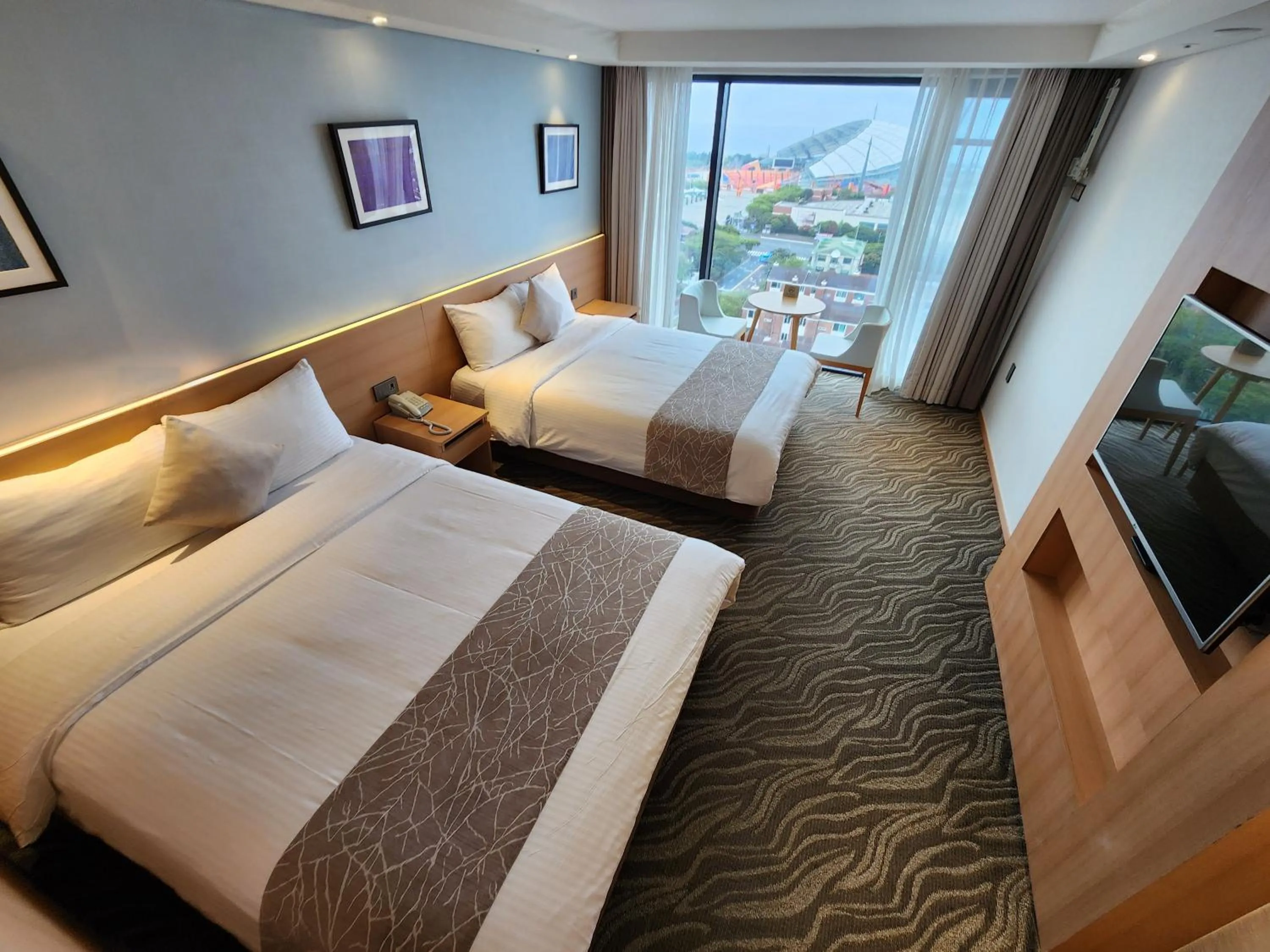 Bed in Seogwipo JS Hotel