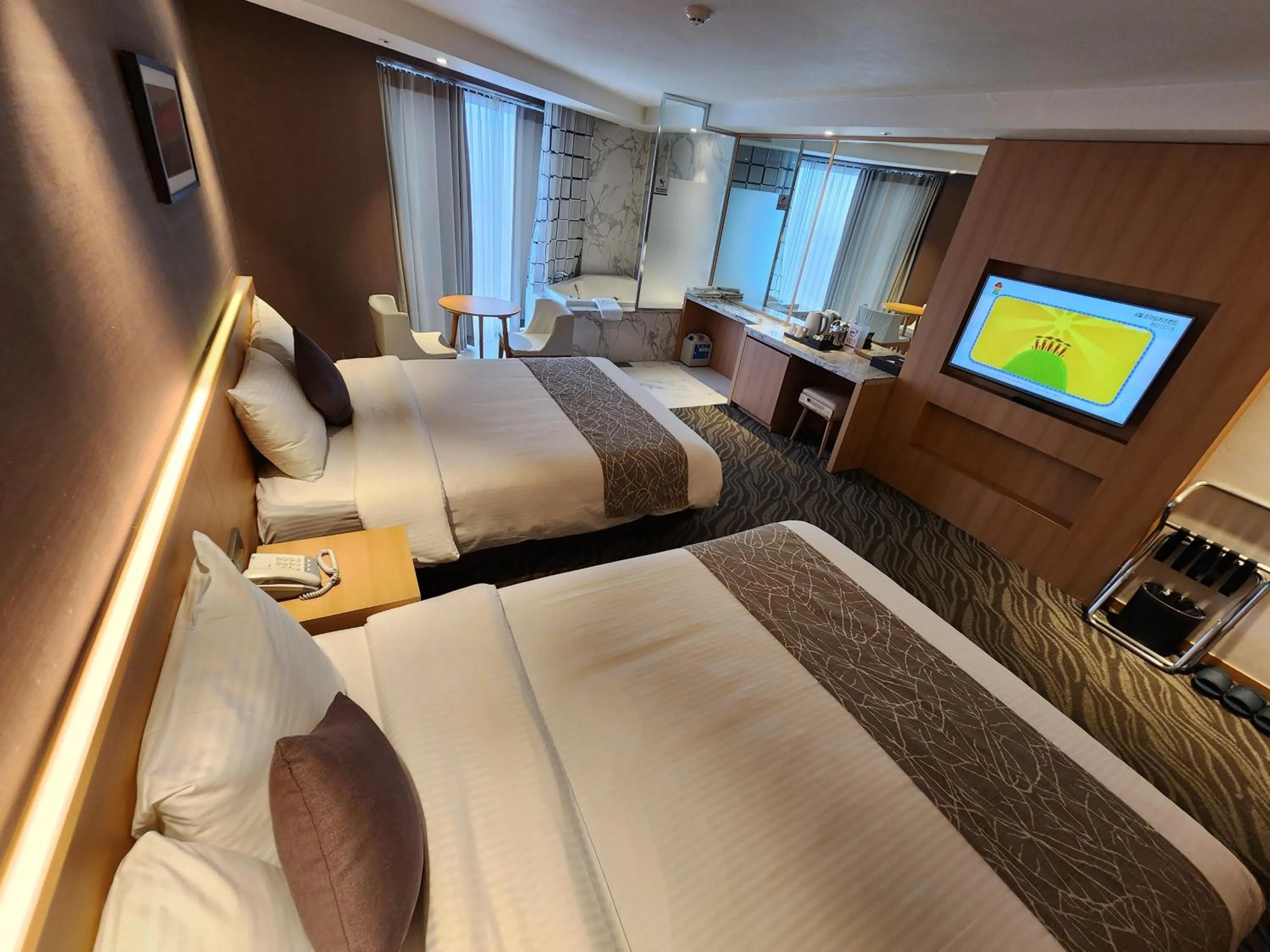 Bed in Seogwipo JS Hotel