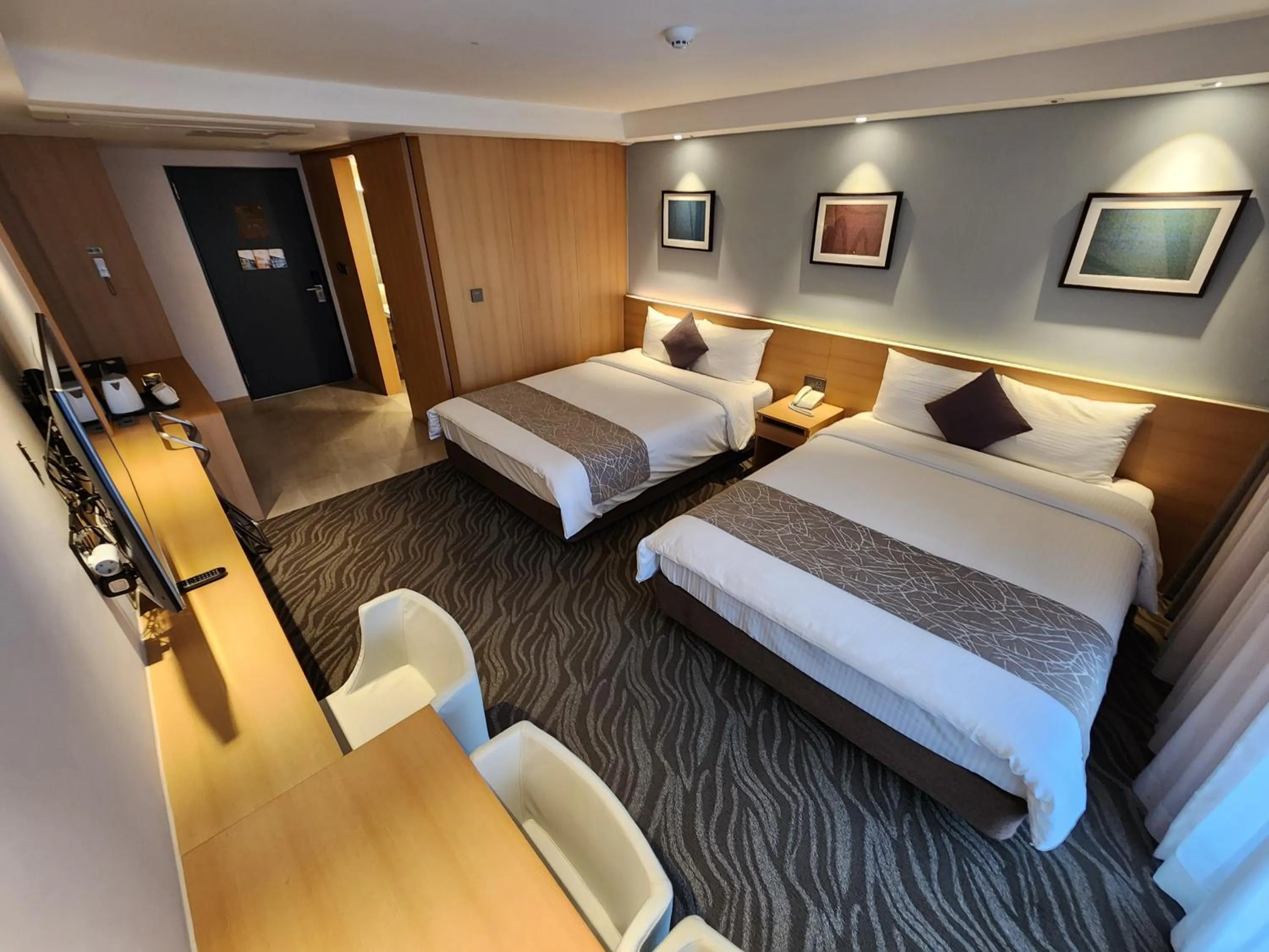 Bed in Seogwipo JS Hotel