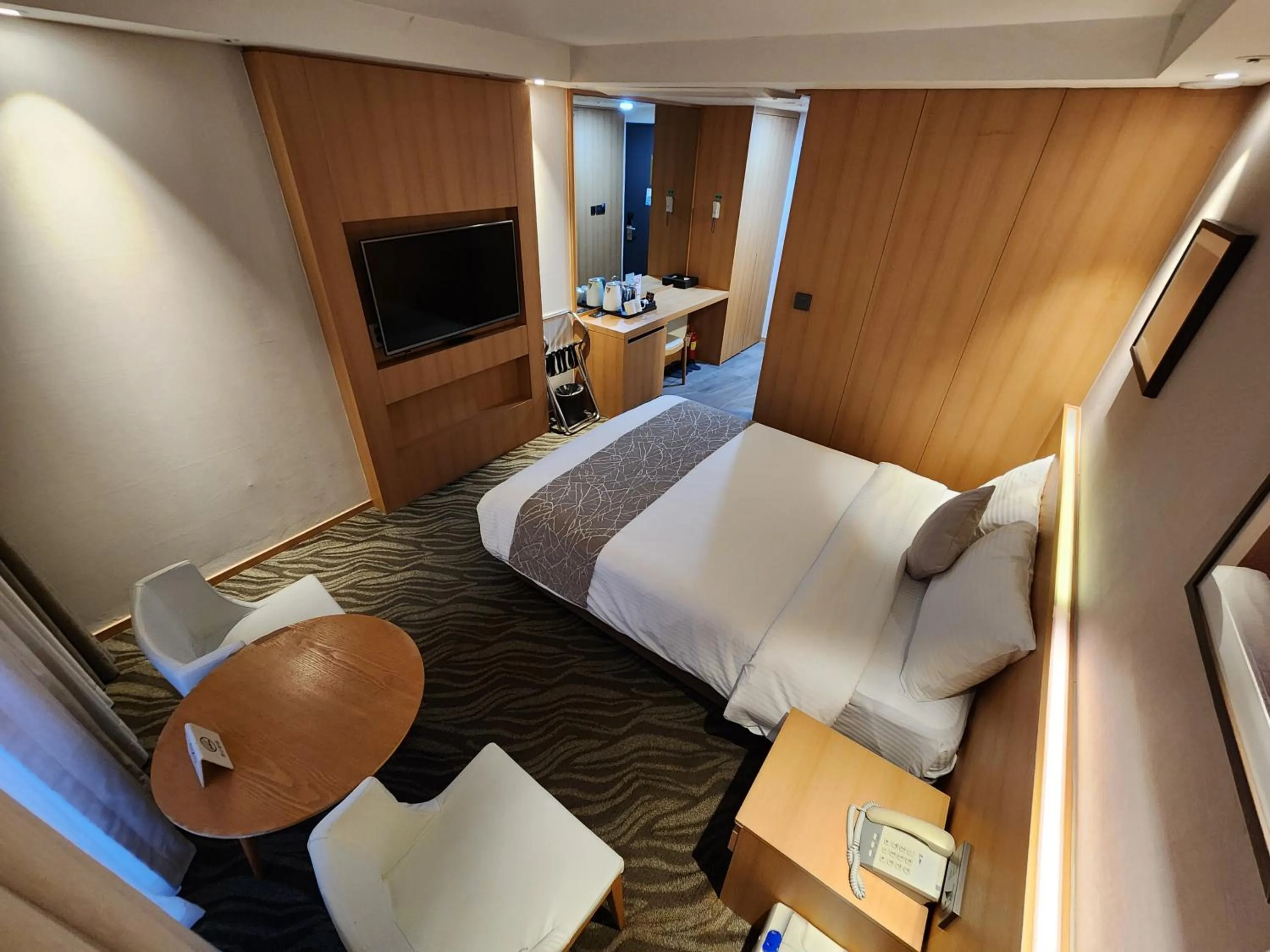 Bed in Seogwipo JS Hotel