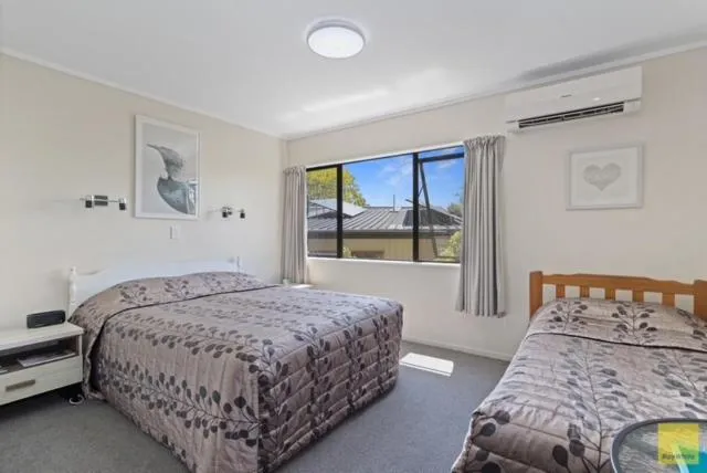 Bed in Waitomo Caves Guest Lodge