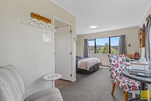 Bed in Waitomo Caves Guest Lodge