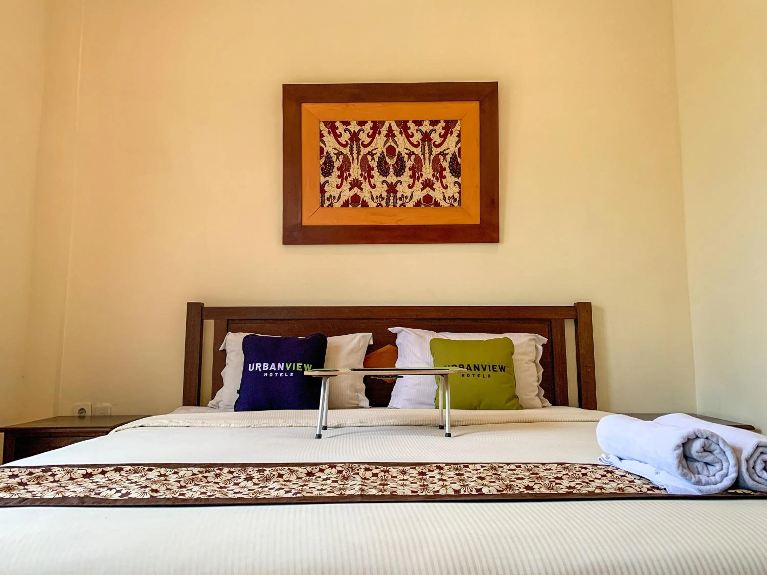 Bed in Urbanview Sasono Putro Condoongcatur by RedDoorz