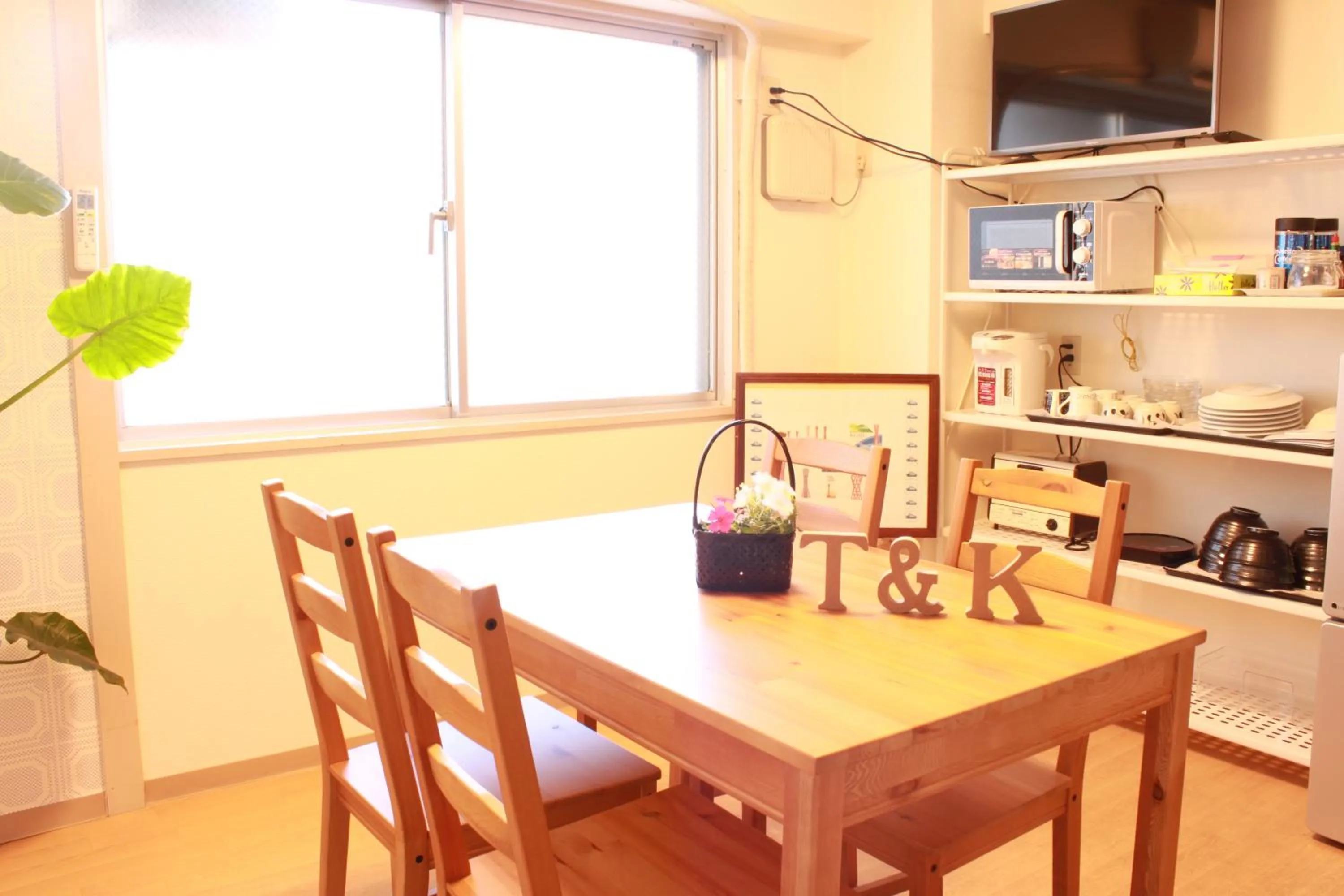 Communal kitchen in T and K Hostel Kobe Sannomiya East