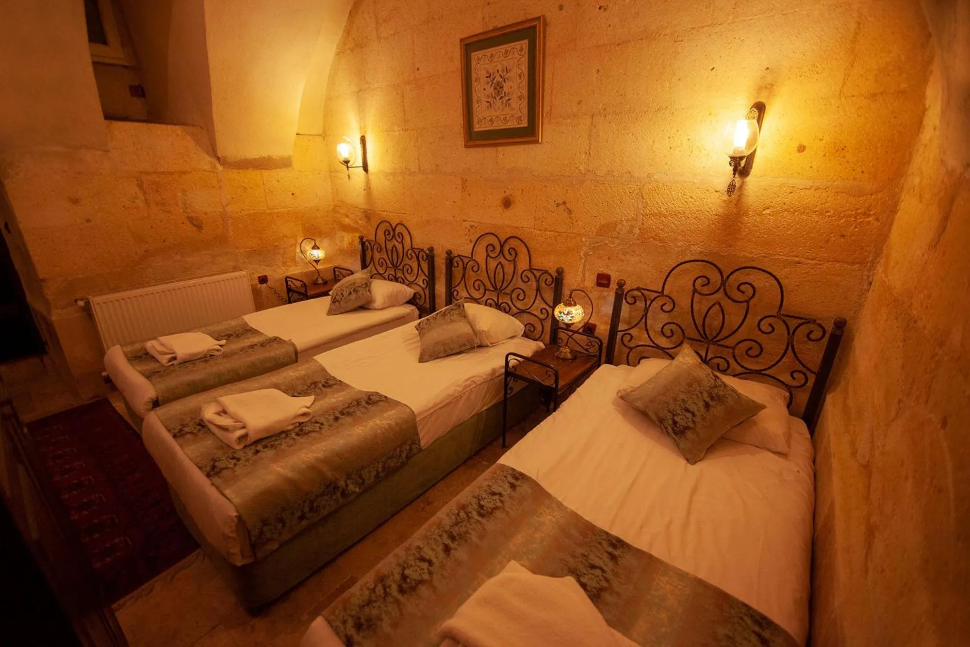 Photo of the whole room, Bed in Center Cave House