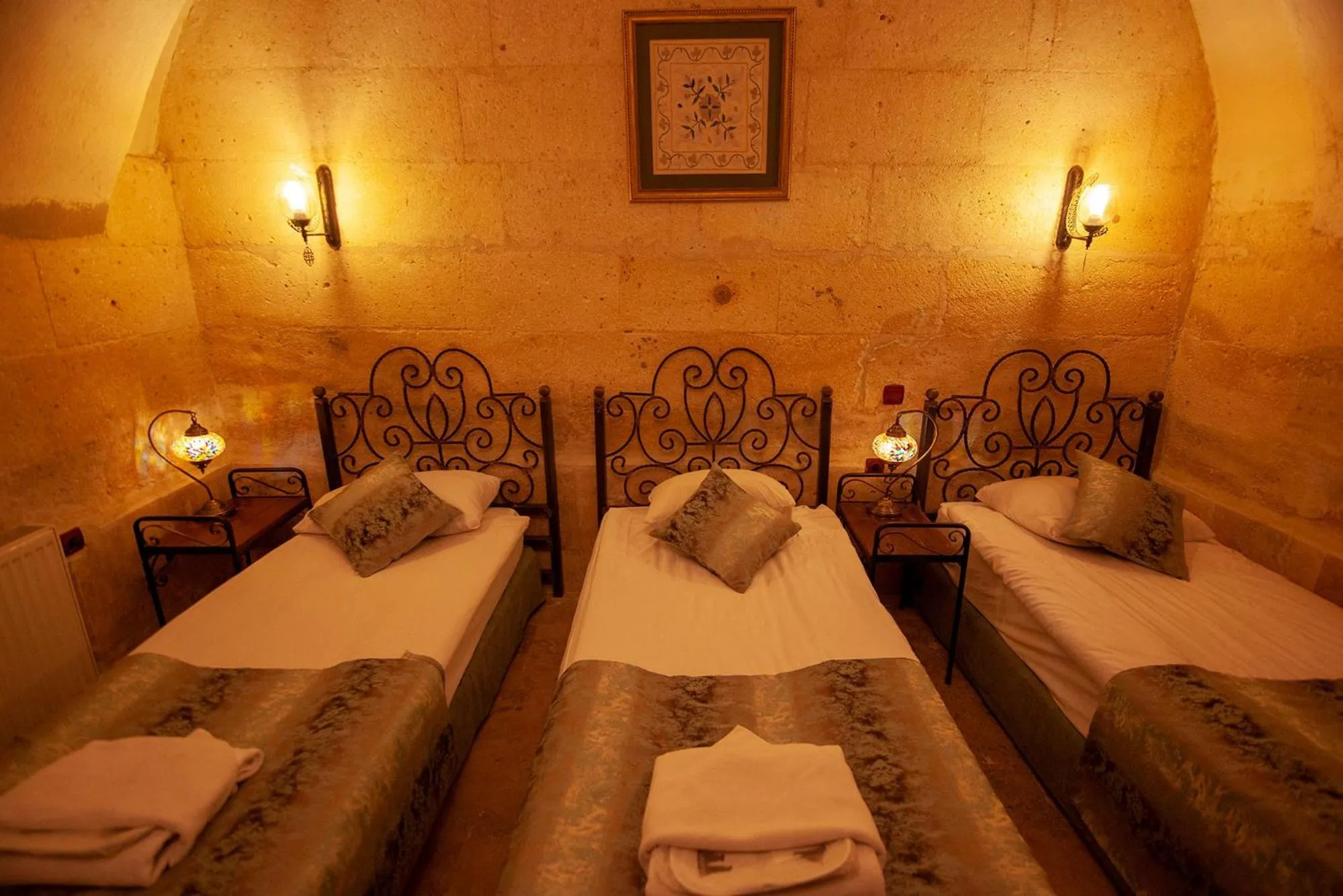 Photo of the whole room, Bed in Center Cave House