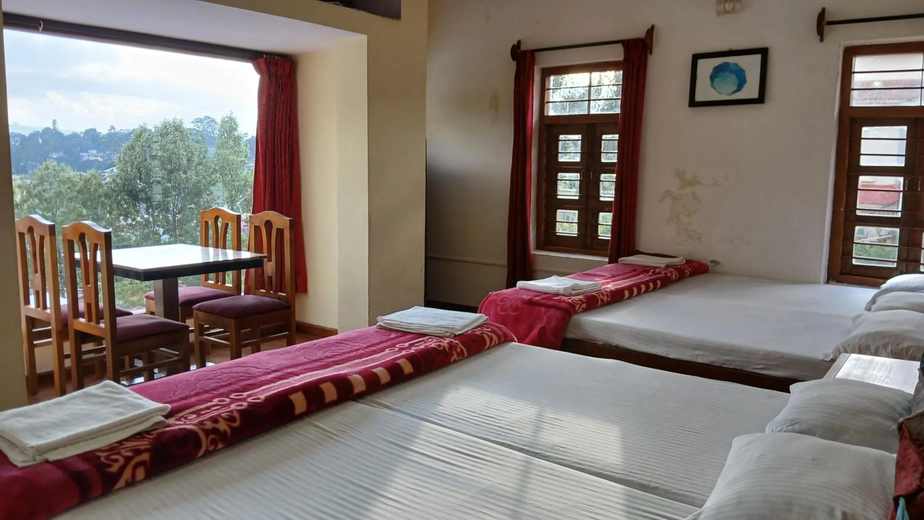 Bed in Satya Anand Cottage Pure Veg and Non Alcoholic Hotel