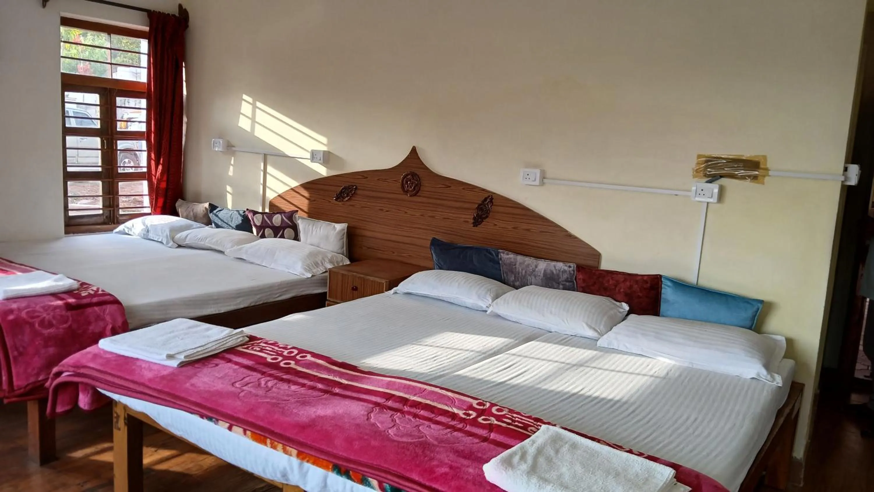Bed in Satya Anand Cottage Pure Veg and Non Alcoholic Hotel