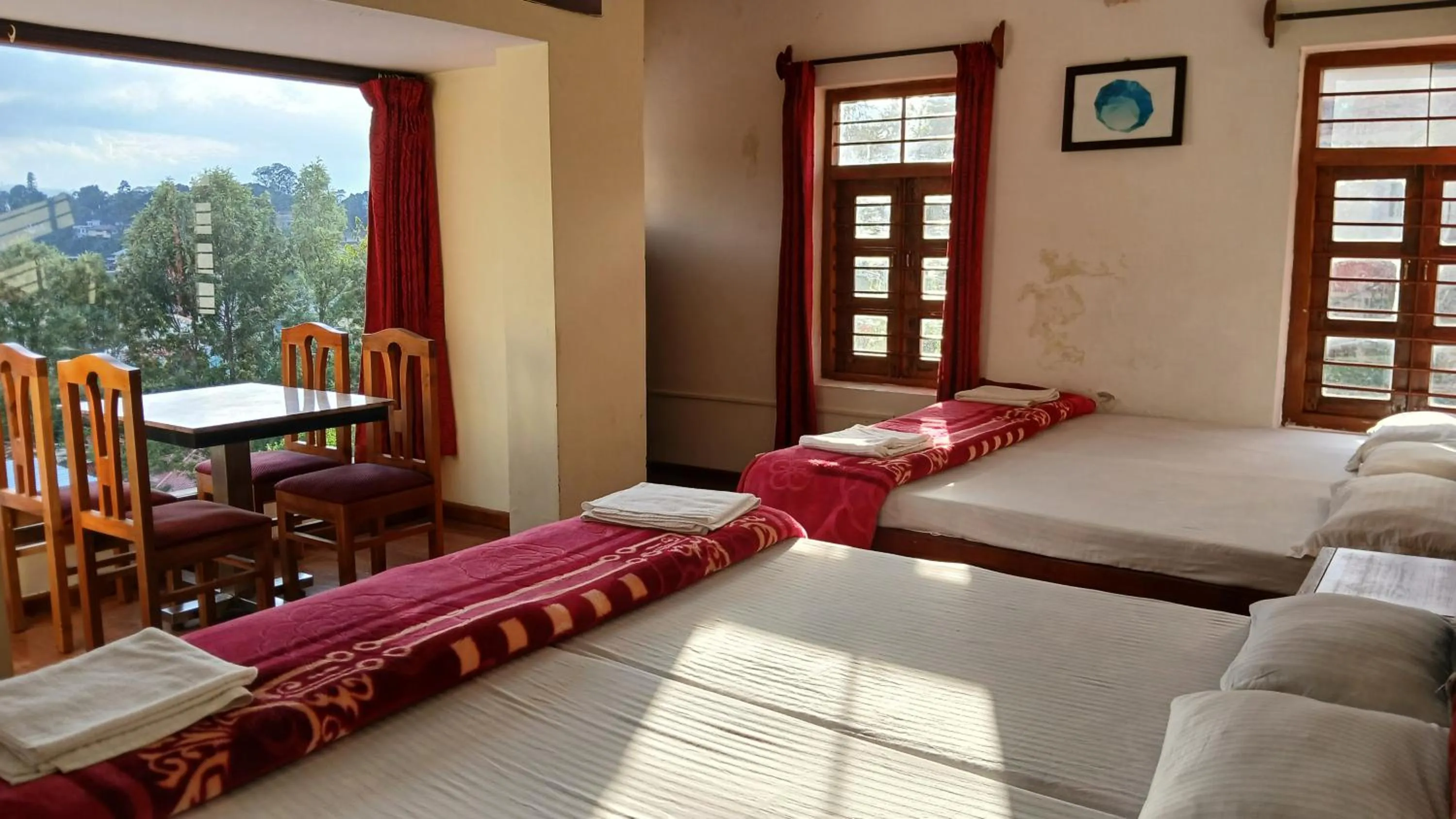 Bed in Satya Anand Cottage Pure Veg and Non Alcoholic Hotel