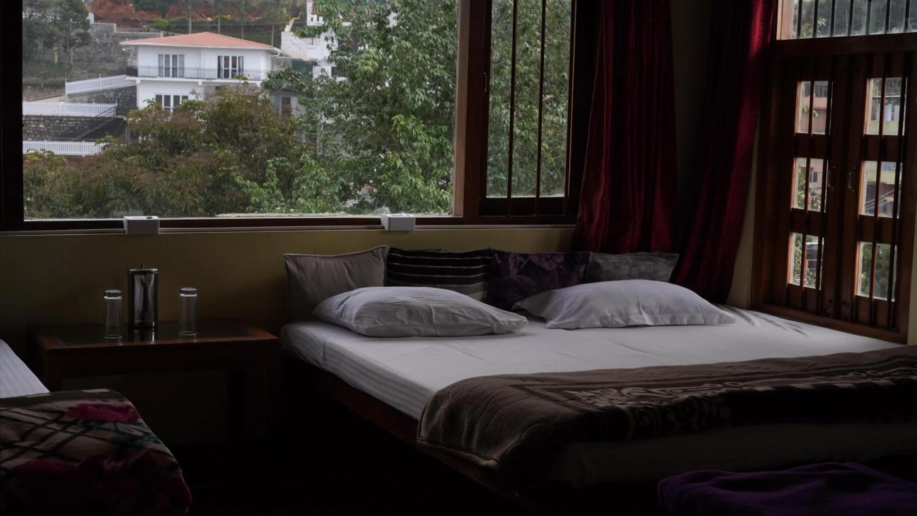 Bed in Satya Anand Cottage Pure Veg and Non Alcoholic Hotel