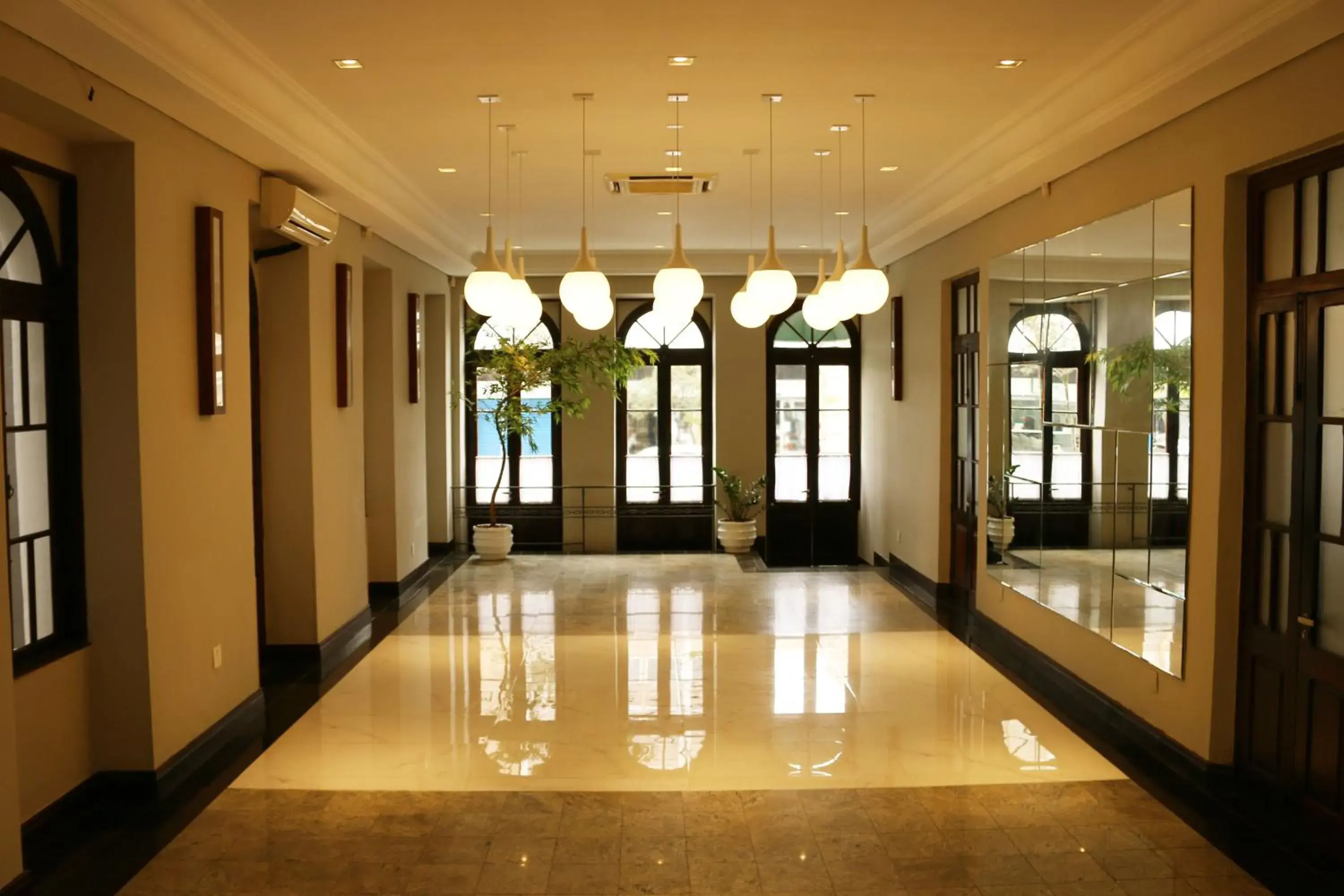 Living room in Johnscher by SJ - San Juan Curitiba Living room in Johnscher by SJ - San Juan Curitiba