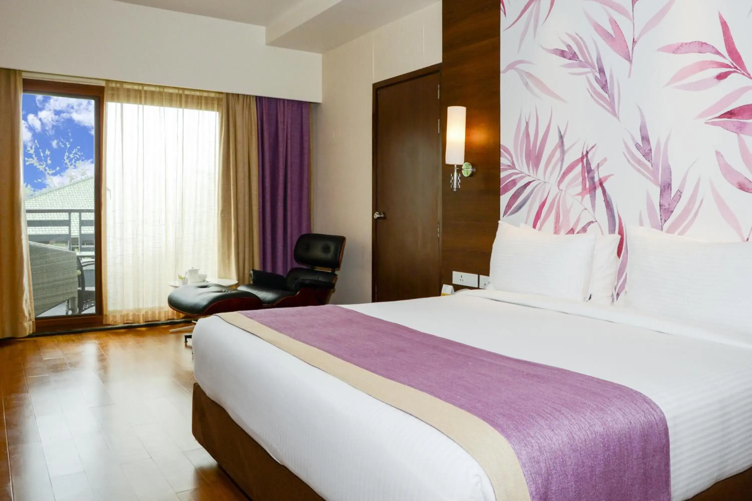 Bed in Purple Palms Resort & Spa Bed in Purple Palms Resort & Spa
