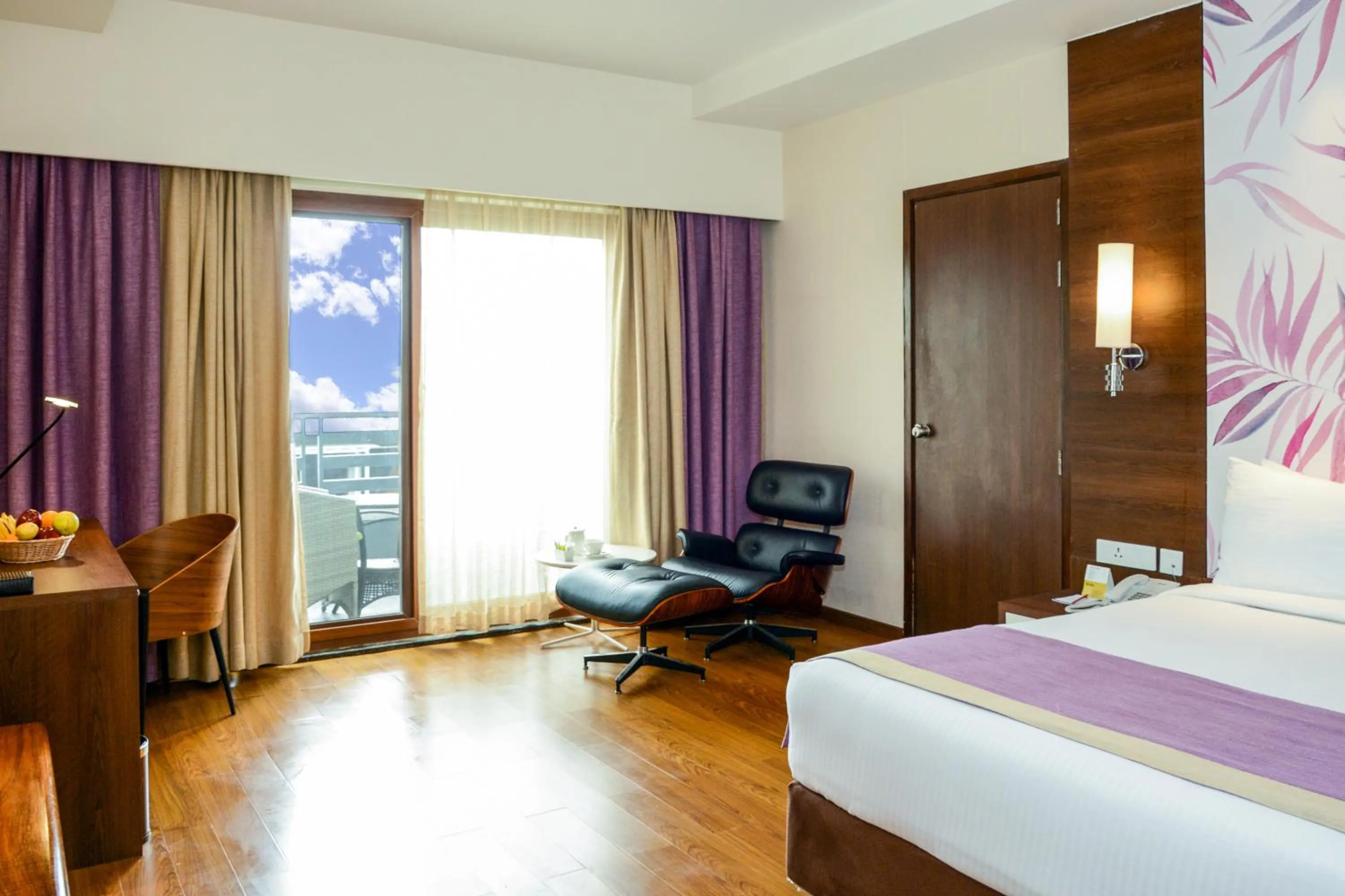 Bed in Purple Palms Resort & Spa