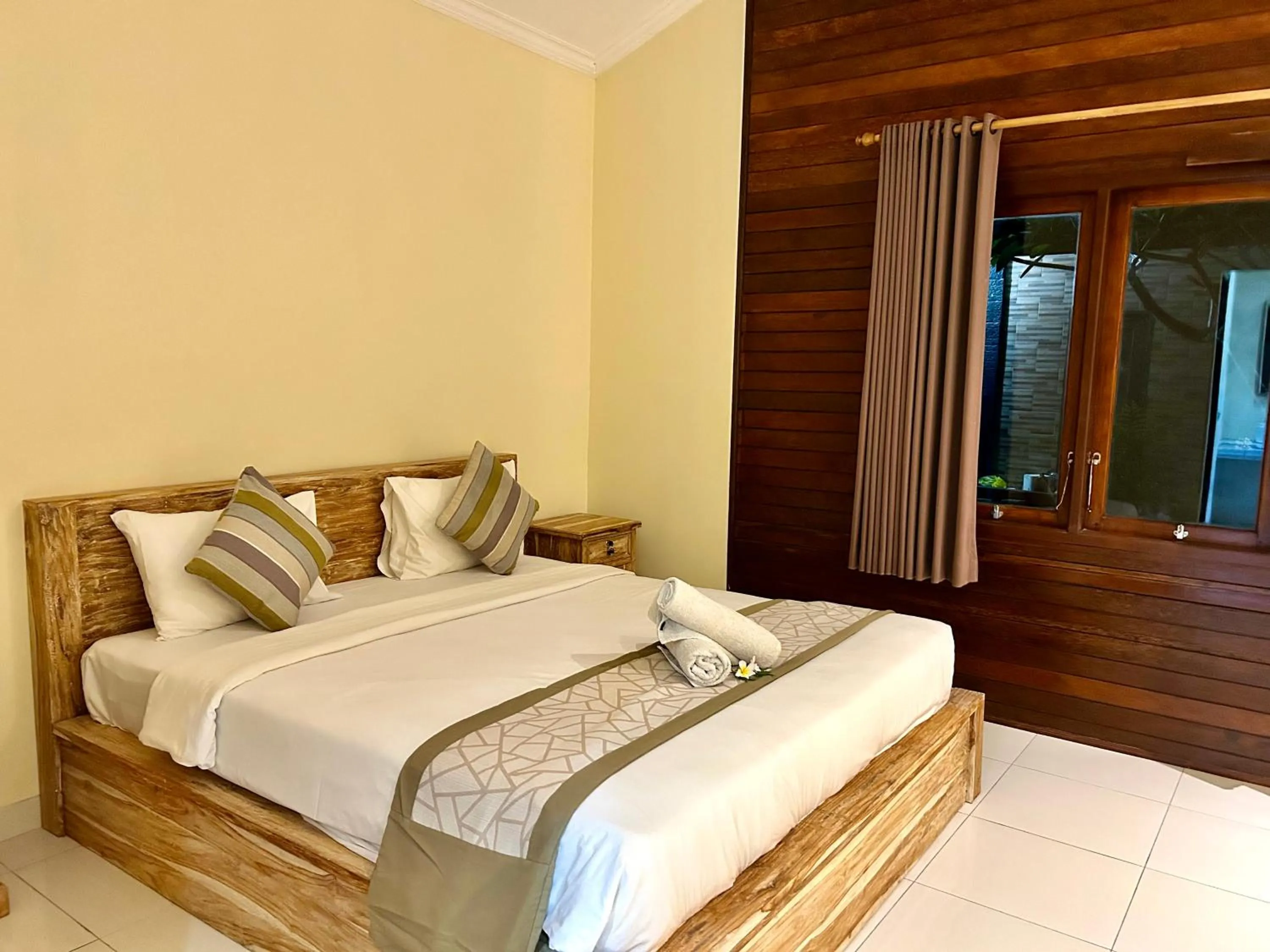 Bed in Nusa Garden Homestay