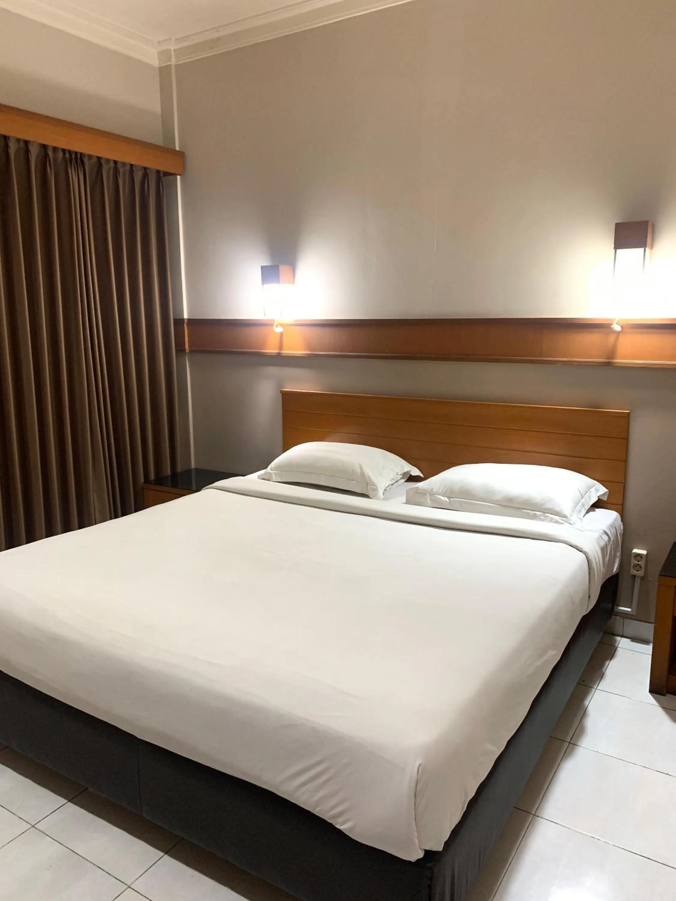 Bed in Hotel Caravan Tanah Abang
