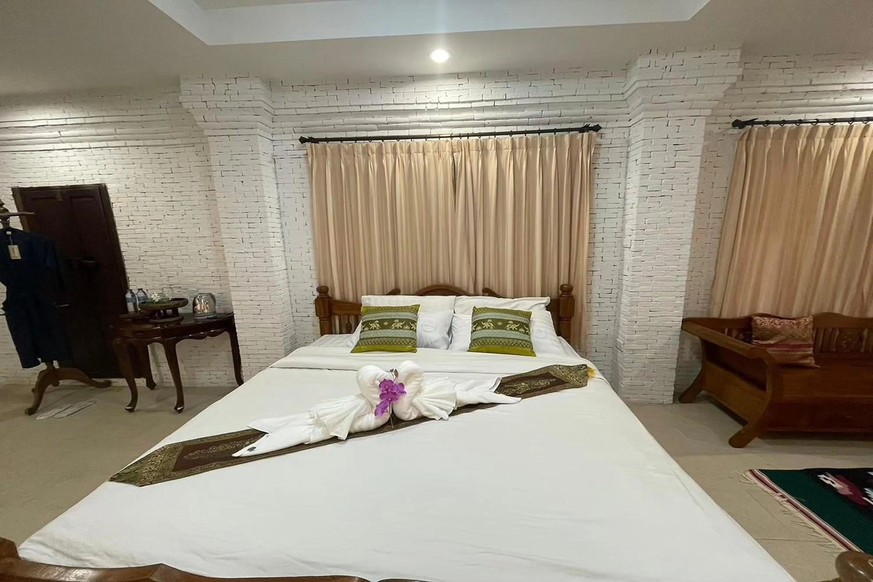 Bed in Baan Tawai Lanna Resort
