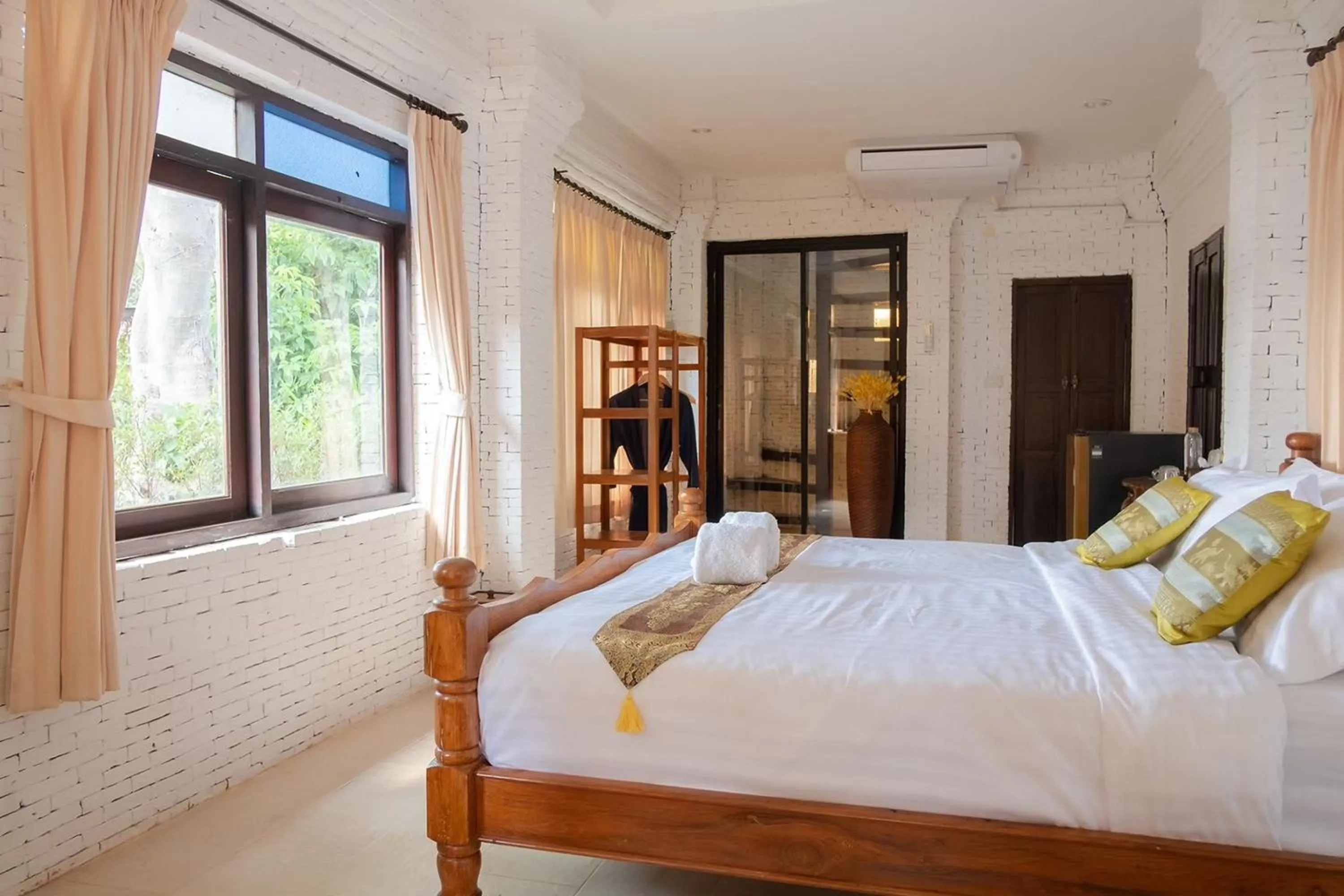 Bed in Baan Tawai Lanna Resort