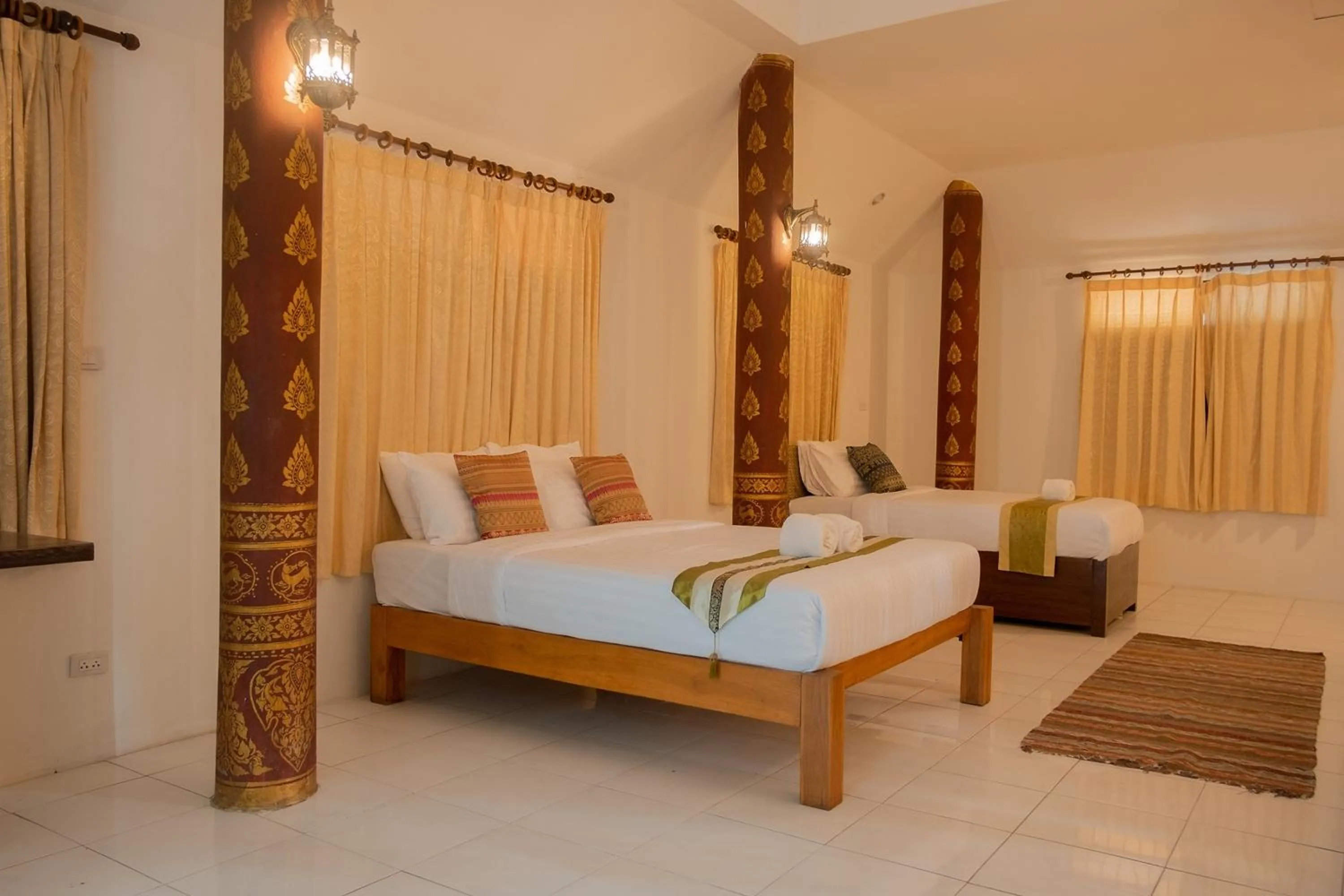 Bed in Baan Tawai Lanna Resort