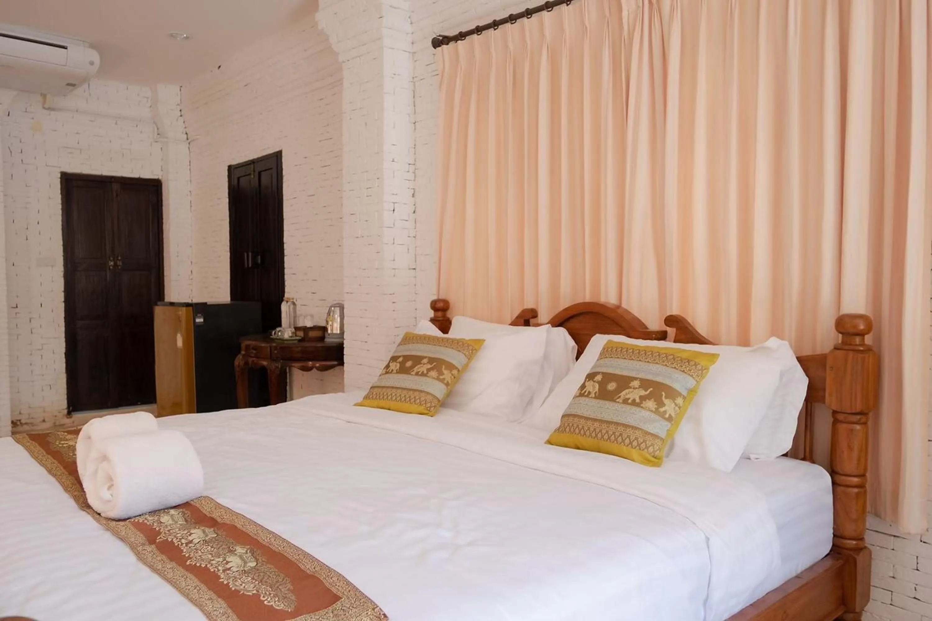 Bed in Baan Tawai Lanna Resort